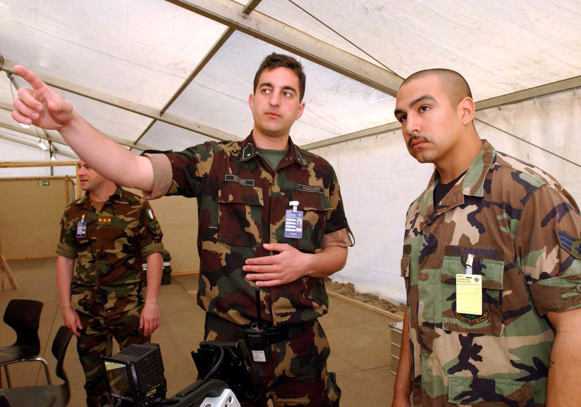 Hungarian army 2nd Lt. Szilard Szarbo briefs Senior Airman Zachariah Anthony Lopez during exercise Combined Endeavor 2007 at Lager Aulenbach, Baumholder, Germany.  The exercise, a U.S. European Command-sponsored exercise, brings the U.S. and other nations together, especially those in NATO or Partnership for Peace, to plan and execute interoperability testing of command, control, communications and computer systems in preparation for future combined humanitarian, peacekeeping and disaster relief operations.  (U.S. Air Force photo/Senior Airman Dayton Mitchell)