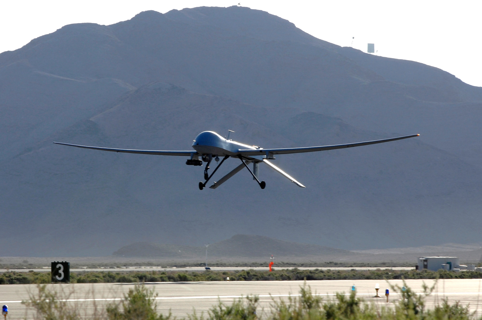 An MQ-1 Predator unmanned aerial vehicle takes off from Creech Air Force Base, Nev., May 11, for a training sortie over the Nevada desert.  Four Predators from the 432nd Wing are ready to deploy, if needed, to help in humanitarian relief efforts in Missouri. (U.S. Air Force photo/Staff Sgt. Brian Ferguson)