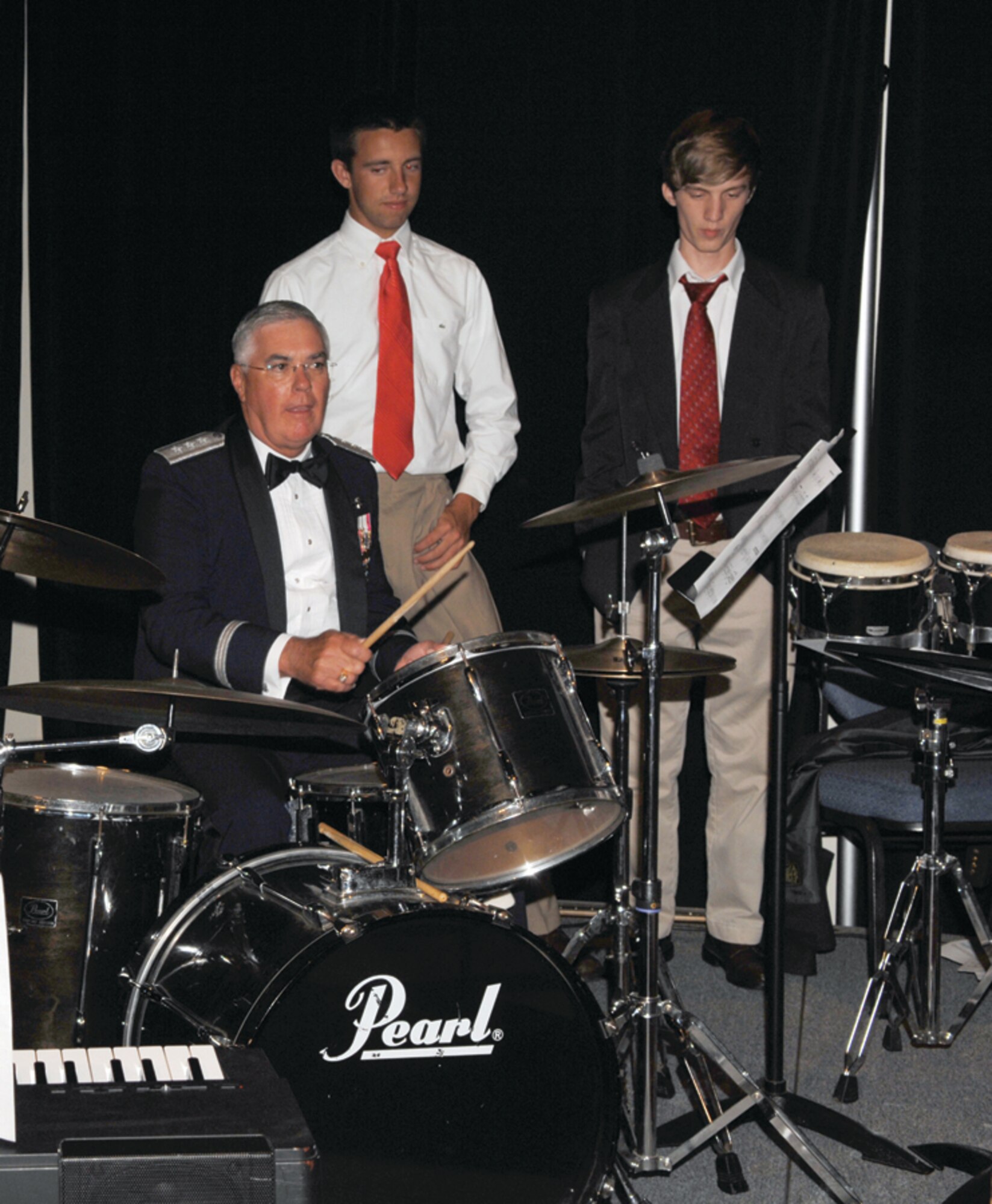 Lt. Gen. Michael Wooley, Air Force Special Operations Command commander, plays an impromptu jam session with the Fort Walton Beach High School Viking Jazz Ensemble at the AFSOC Outstanding Airmen of the Year banquet May 4.  (U.S. Air Force photo by Senior Airmen Cynthia Morrow)