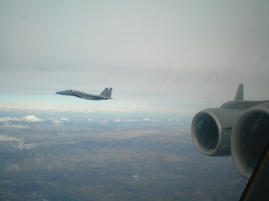 MCCHORD AIR FORCE BASE, Wash. -- An F-15 Eagle from Klamath Falls, Ore., flies alongside a McChord C-17 Globemaster III as part of a Simulated Penetration Air Defense Exercise scenario over central Washington in February. The C-17 is playing the role of a hijacked airliner. (U.S. Air Force photo)
