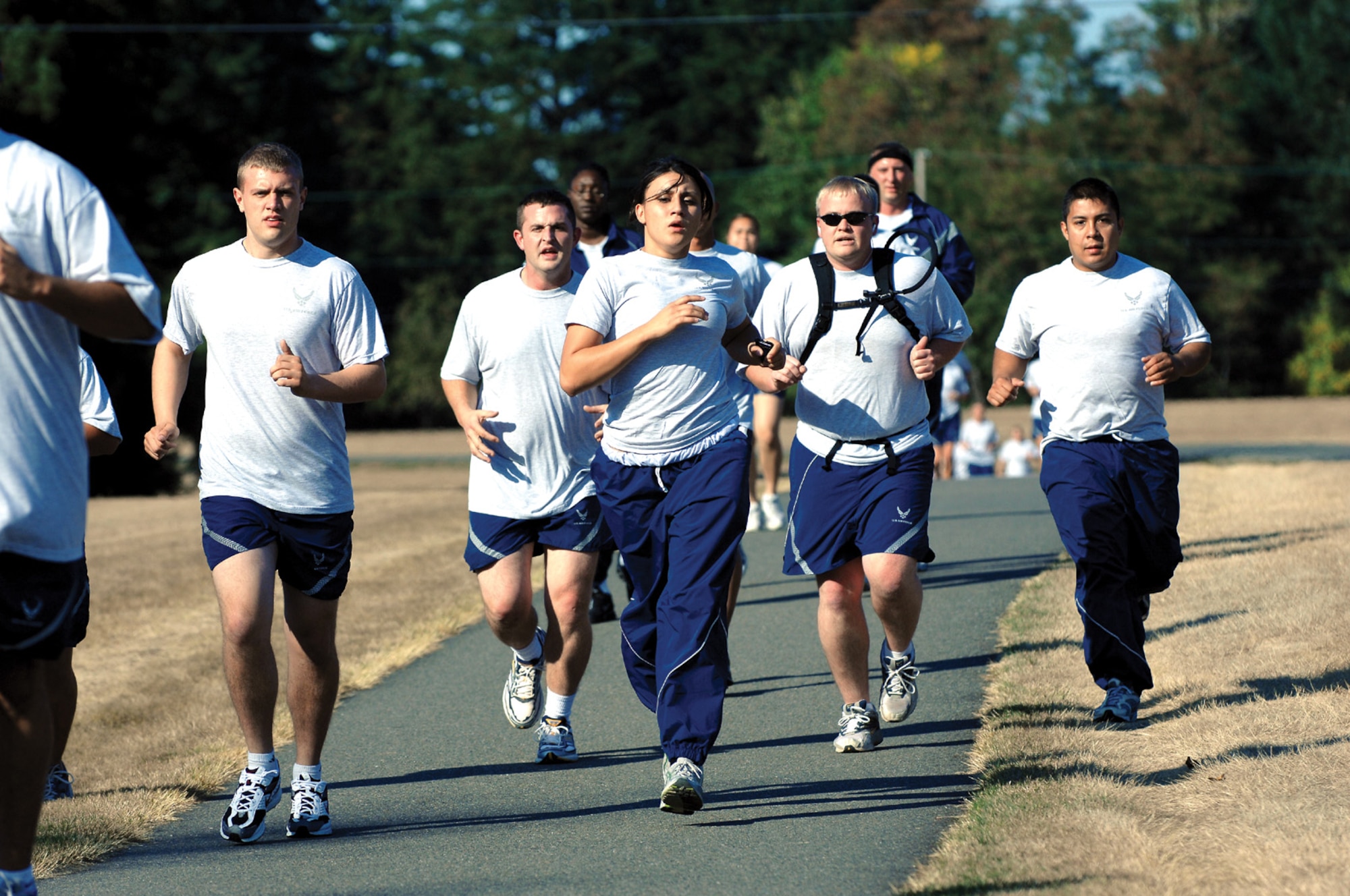 MCCHORD AIR FORCE BASE, Wash. -- Airmen participate in an eight-mile run on one of the base’s running trails in October 2006. The running clinic will teach Airmen how to improve their running cadence, power and stride length to increase their overall running speed Monday at the base track. (U.S. Air Force photo/Abner Guzman)

