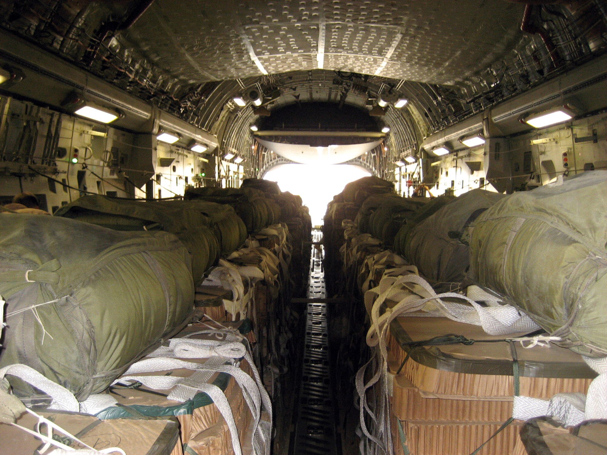 Pallets of ammunition wait to be airdropped from a C-17 Globemaster III.  The load was dropped to Soldiers in Afghanistan engaged in combat with anti-coalition forces.  Airdrops provide vital supplies to coalition forces in remote areas that can not be safely supplied by ground transportation.  (U.S. Air Force photo/1st Lt. David Myrick)