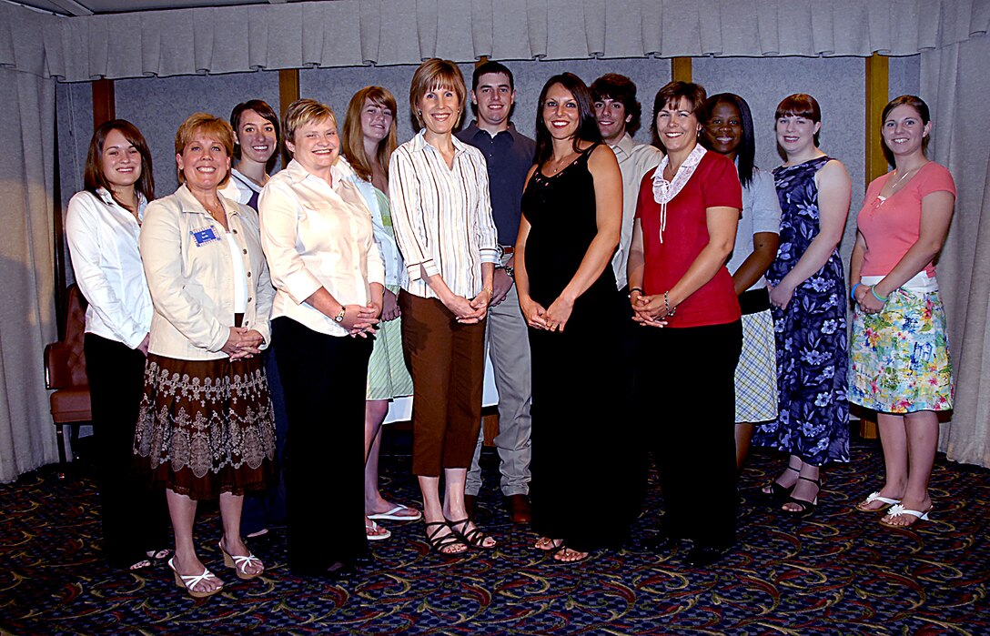 The Sheppard Squadron Officer's Spouses Club awarded $12,750 in scholarships to Sheppard dependents May 7 at the Sheppard Club. Pictured are: (front row) Jan Saville (scholarship chairperson) , Lynette Watts, Kathy Vossler, Eva Urbinelli and Shelly Mullen. (Back row) Carly Moree, Holly Williams, Abigail McKay, Kyle Weldon, Matthew Tisdale, Erica Garnett, Catherine Orozco and Christina Cerruti. (U.S. Air Force photo/Harry Tonemah)