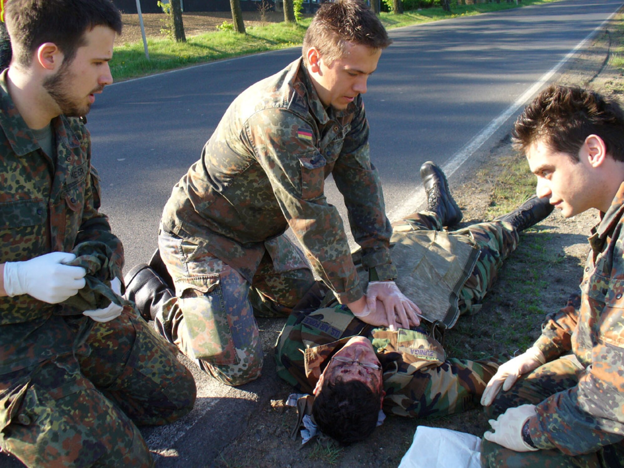 BUECHEL AIR BASE, GERMANY -- Medical personnel from the 33rd Bomber/Fighter Wing simulate administering cardio- pulmonary resuscitation on Senior Airman Jose Zuniga, 702nd Munitions Support Squadron. (Photo by Master Sgt. Jorg Benzrath)