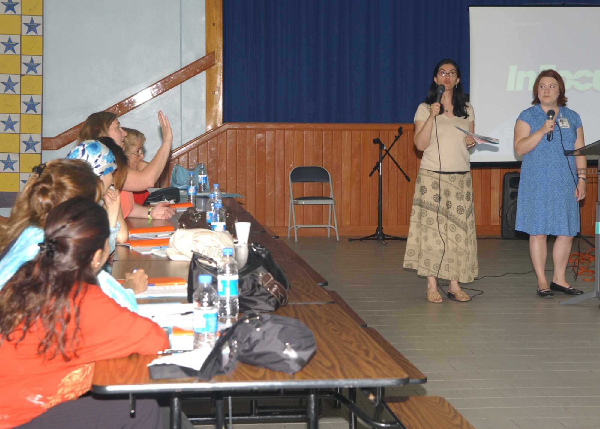 Ms Lesley Evans, left, a registered nurse, speaks at the Child Care and Development Seminar Saturday May 5 while Mrs. Ozlem Wierzbicki, right, translates.  The seminar was hosted by the Family Advocacy Program and included guest speakers who talked about cultural differences, behavior management, nutrition and food handling, dental care, early childhood education, and safety practices.  (U.S. Air Forces photo by Airman 1st Class Tiffany Colburn).
	

