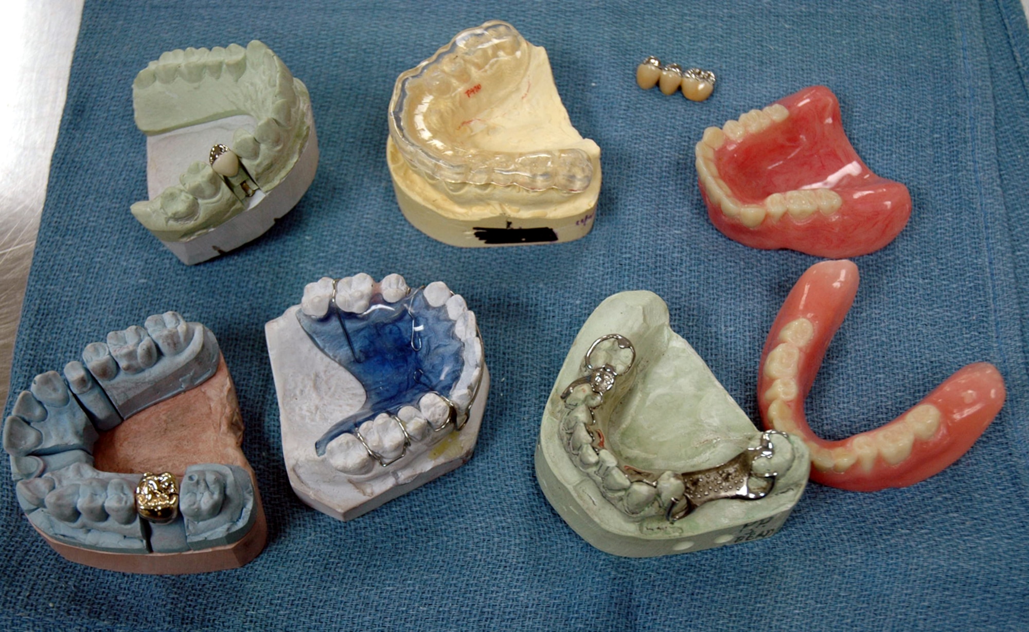 OSAN AIR BASE, Republic of Korea --  Examples of work that 51st Dental Squadron lab technicians do every day, including gold crowns, dentures and nightguards. (U.S. Air Force photo by Staff Sgt. Benjamin Rojek)