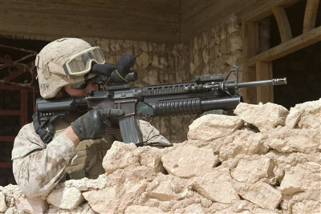 U.S. Marine Corps Cpl. Marc R. McGarry provides security during a security halt as part of a presence patrol in Hadithah, Iraq, on April 26, 2007.  McGarry is assigned to 2nd Platoon, Bravo Company, 1st Battalion, 3rd Marine Regiment.  