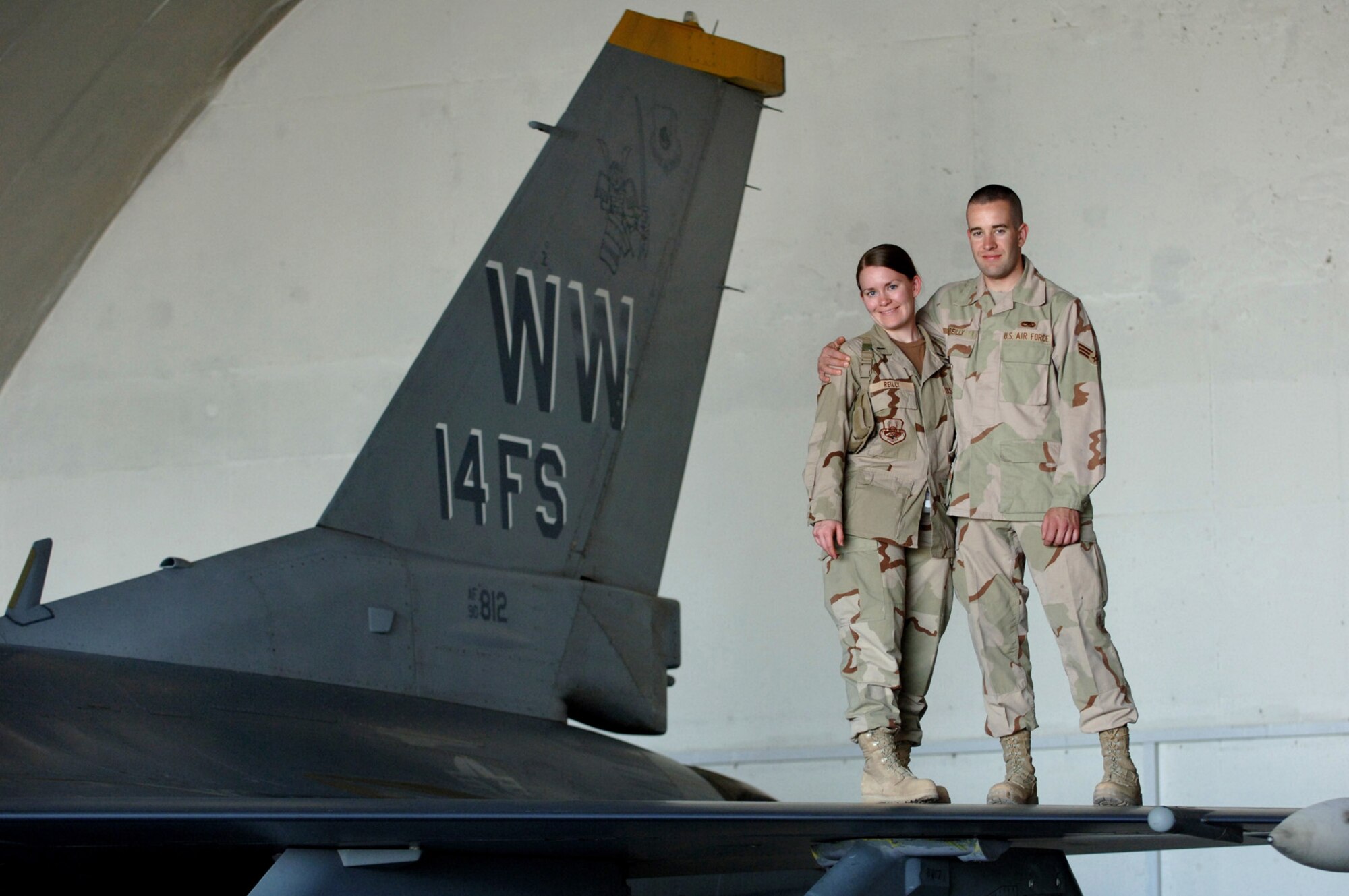 BALAD AIR BASE, Iraq - Senior Airman Kevin Reilly, 332nd Expeditionary Aircraft Maintenance Squadron, is reunited with his sister, 1st Lt. Erin Reilly, 506th Expeditionary Logistics Readiness Squadron. Lt. Reilly flew to Balad Air Base May 8 from Kirkuk Regional Air Base, Iraq, to surprise her little brother on his promotion day to senior airman below-the-zone. (U.S. Air Force photo/Staff Sgt. Michael R. Holzworth)