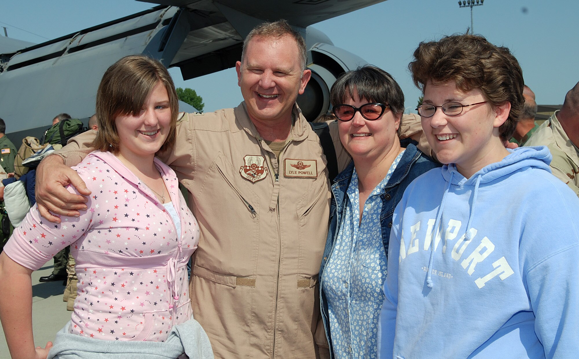 FAIRCHILD AIR FORCE BASE, Wash.—Col. Lyle Powell, 92 Air Refueling Wing special assistant to the commander takes time to take a picture with his wife, Jo, and two daughters, Madison, 13, and Aubrey, 16. Colonel Powell has been deployed since December to Afghanistan as the deputy director air component coordination element. (U.S. Air Force photo / Tech. Sgt. Larry Carpenter)