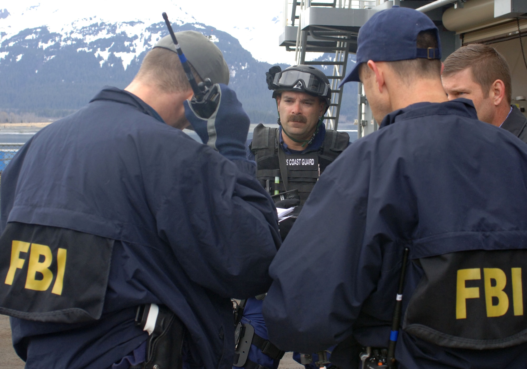SEWARD, Alaska (May 11, 2007) – A member of U.S. Coast Guard Maritime Safety & Security Team, Anchorage (MSST 91111) speaks with a FBI special agent after completing a search of USNS Henry J. Kaiser (T-AO 187) as part of Alaska Shield/Northern Edge 07 (AKS/NE 07). AKS/NE 07 is a State of Alaska/US NORTHCOM sponsored homeland defense/defense support of civil authorities exercise; part of the national-level Ardent Sentry/Northern Edge 07.  It’s an opportunity to practice responding to homeland defense/disaster events with the federal, state, local & private-sector team. U.S. Navy photo by Mass Communication Specialist 1st Class Daniel N. Woods