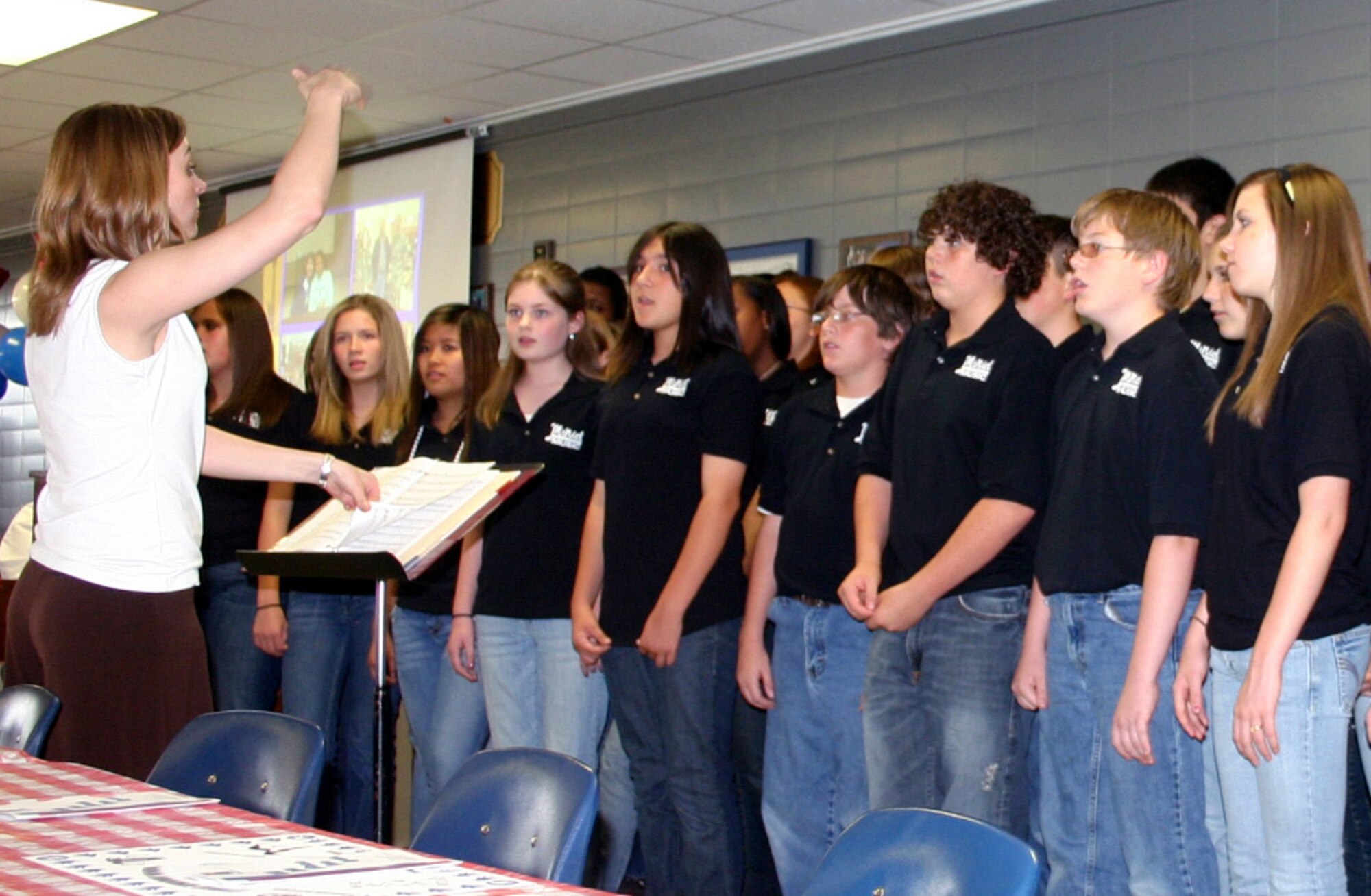 Members of the McNiel Junior High School choir sing "Like an Eagle" to entertain attendees at the Student Achievement Initiative Appreciation ceremony May 10. (U.S. Air Force photo/Staff Sgt. Tonnette Thompson)