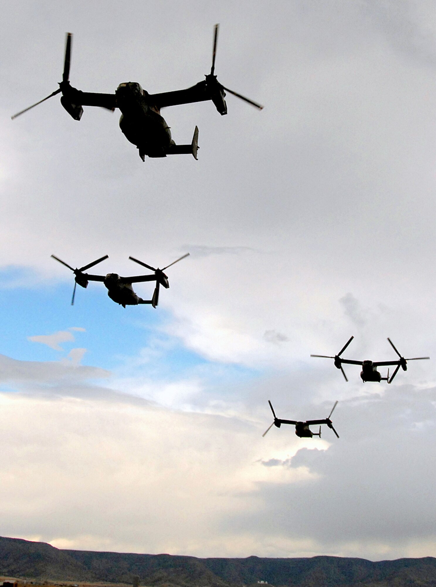 A formation of CV-22 Ospreys flies over the auxillary field here. This formation, which was flown on May 1, was the largest to date for the Air Force. U.S. Air Force Photo by Todd Berenger