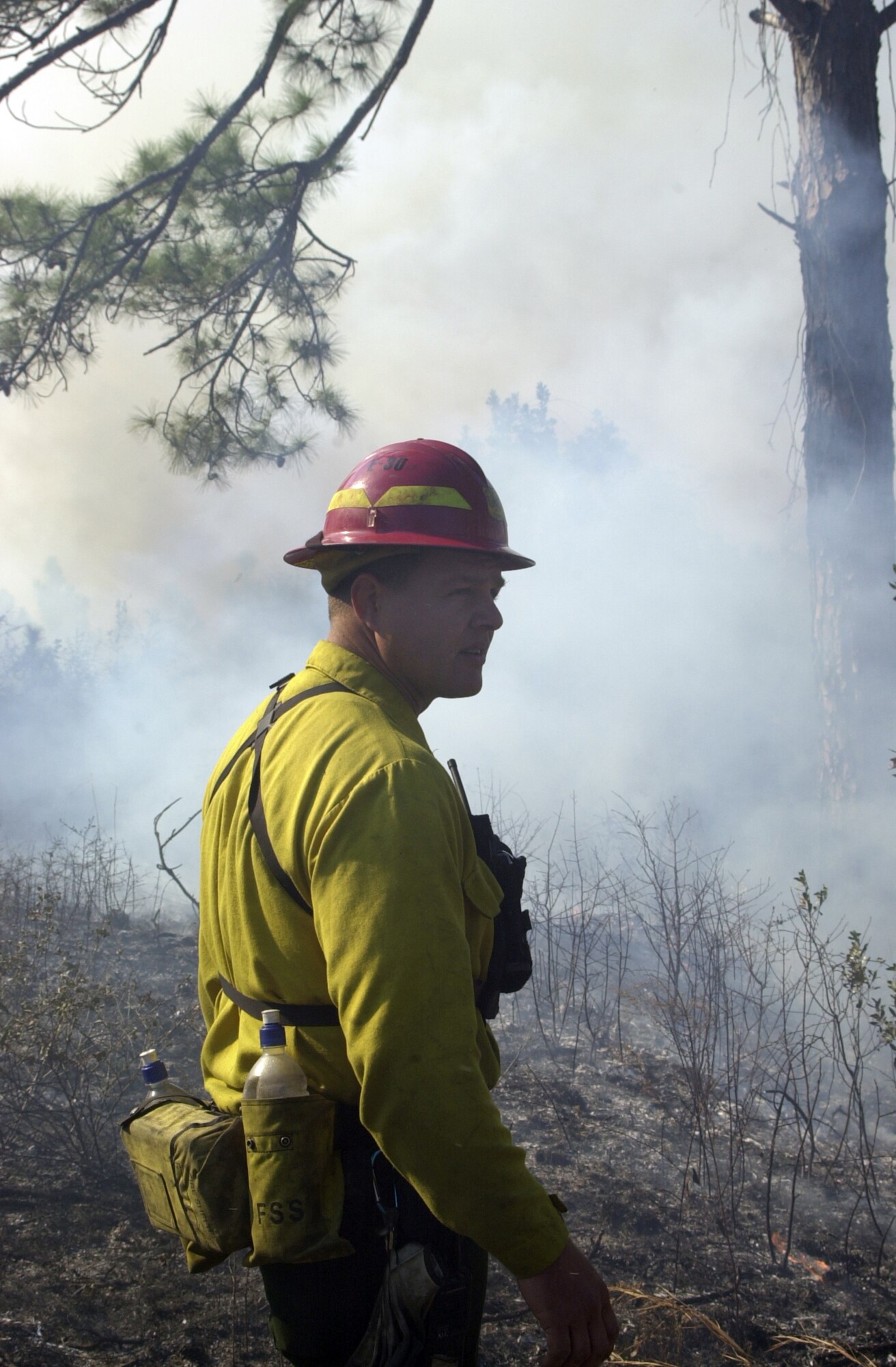 Terry Walter monitors a control burn recently on Tyndall Air Force Base, Fla. Tyndall AFB firefighters responded to recent wildfires in Florida when the Department of Forestry requested assistance controlling rampant wildfires. Mr. Walter is the wildland fire program manager for the 325th Civil Engineer Squadron. (U.S. Air Force photo)