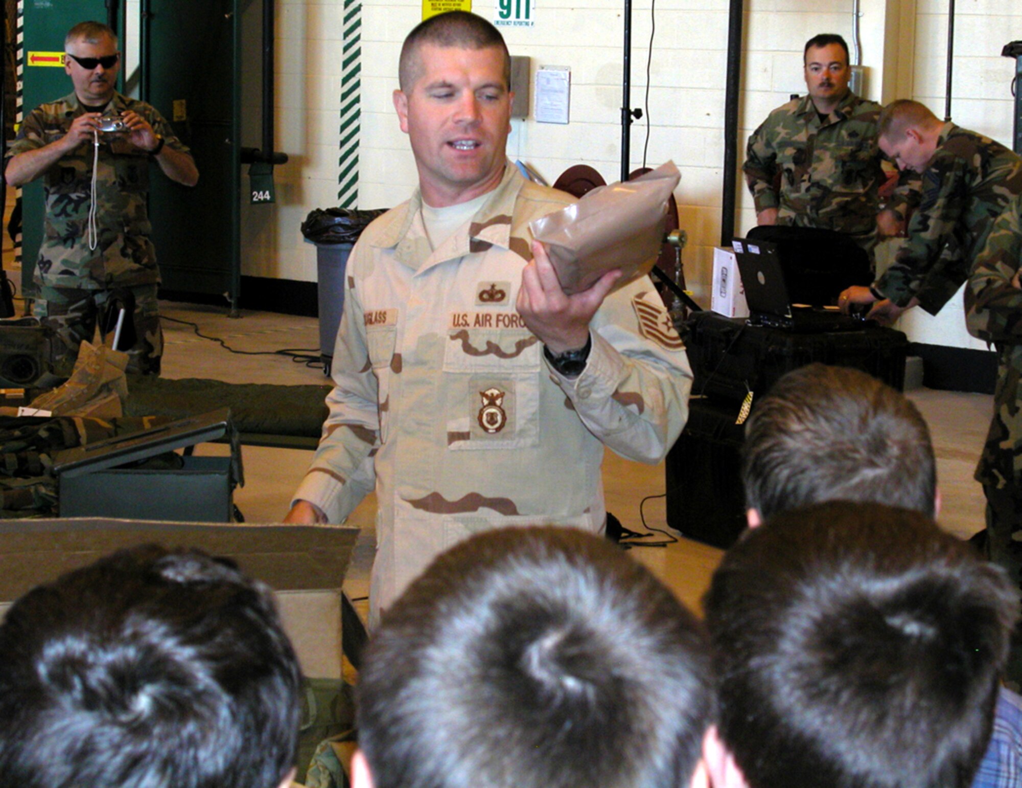 GRISSOM AIR RESERVE BASE, Ind., -- Tech. Sgt. David Douglass, 434th Security Forces Squadron, shares information about the unique delicacies of the military meal ready to eat (MRE) that are issued to military members in the field. The briefing took place May 14 at Grissom as part of a National Police Week observance. (Air Force Photo/Senior Airman Chris Bolen)