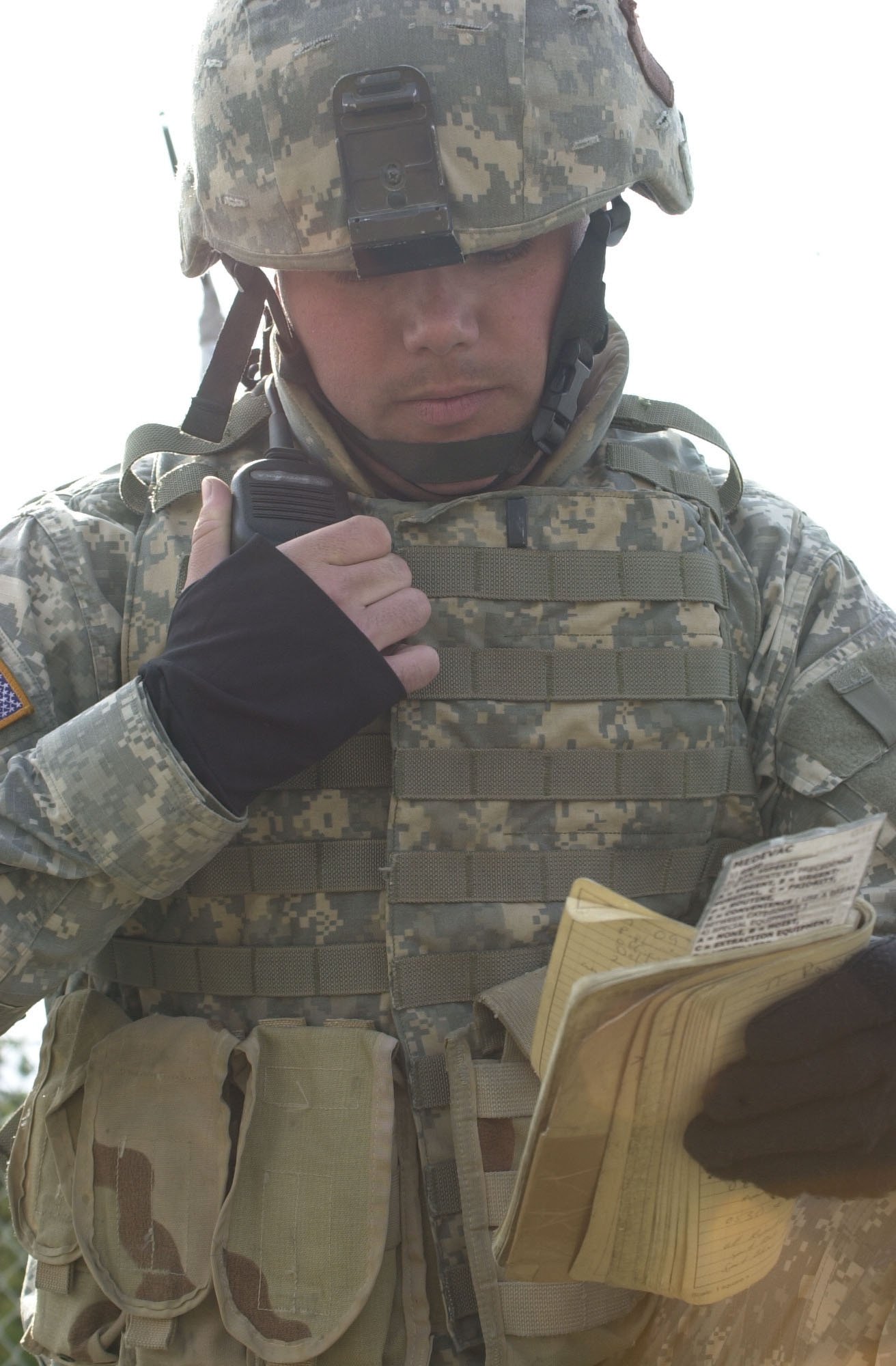 NORTH POLE, Alaska – A National Guardsmen from Nebraska radios in for support after his unit detained a suspected terrorist during an Alaska Shield/Northern Edge 07 scenario here May 9. His radio is networked to the communications systems of other participating local, state, federal and private agencies due to an initiative called the Incident Command System.  This cross-agency system improves coordinated response to emergencies such as natural disasters or terrorist attacks. (U.S. Air Force photo by Staff Sgt. J.G. Buzanowski)