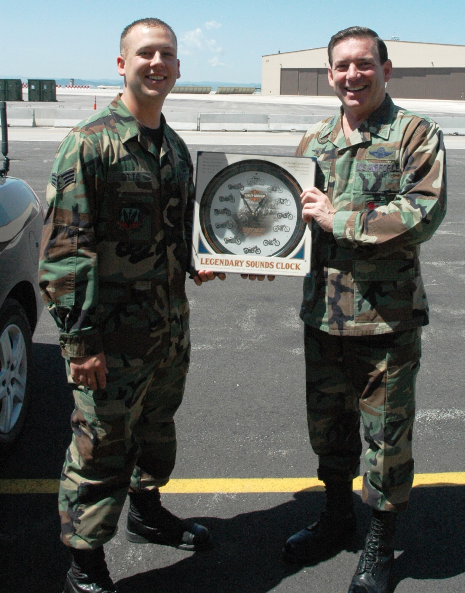 Col. Jeffry Smith, 28th Bomb Wing commander accepts a token of appreciation from Senior Airman Steven Otto, 28th Bomb Wing Active Airmans Council president during a junior enlisted farewell luncheon held here May 11.  The Ellsworth Group 5/6 sponsored the event in honor of Col. Smith's past 2 years as the bomb wing commander.  Col. Smith will turn over the wing to Col. Scott Vander Hamm during a change of command ceremony on June 1. (U.S. Air Force photo/Tech. Sgt. Todd Wivell)