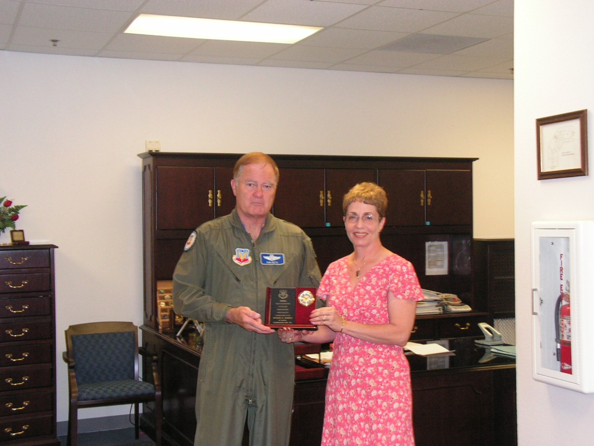 General Robert Keys, ACC Commander, presents Ms. Susan Bibus, 67th Network Warfare Wing with the 2006 ACC Civilian Personnel Specialist of the Year Award during his visit to the wing on May 11.  