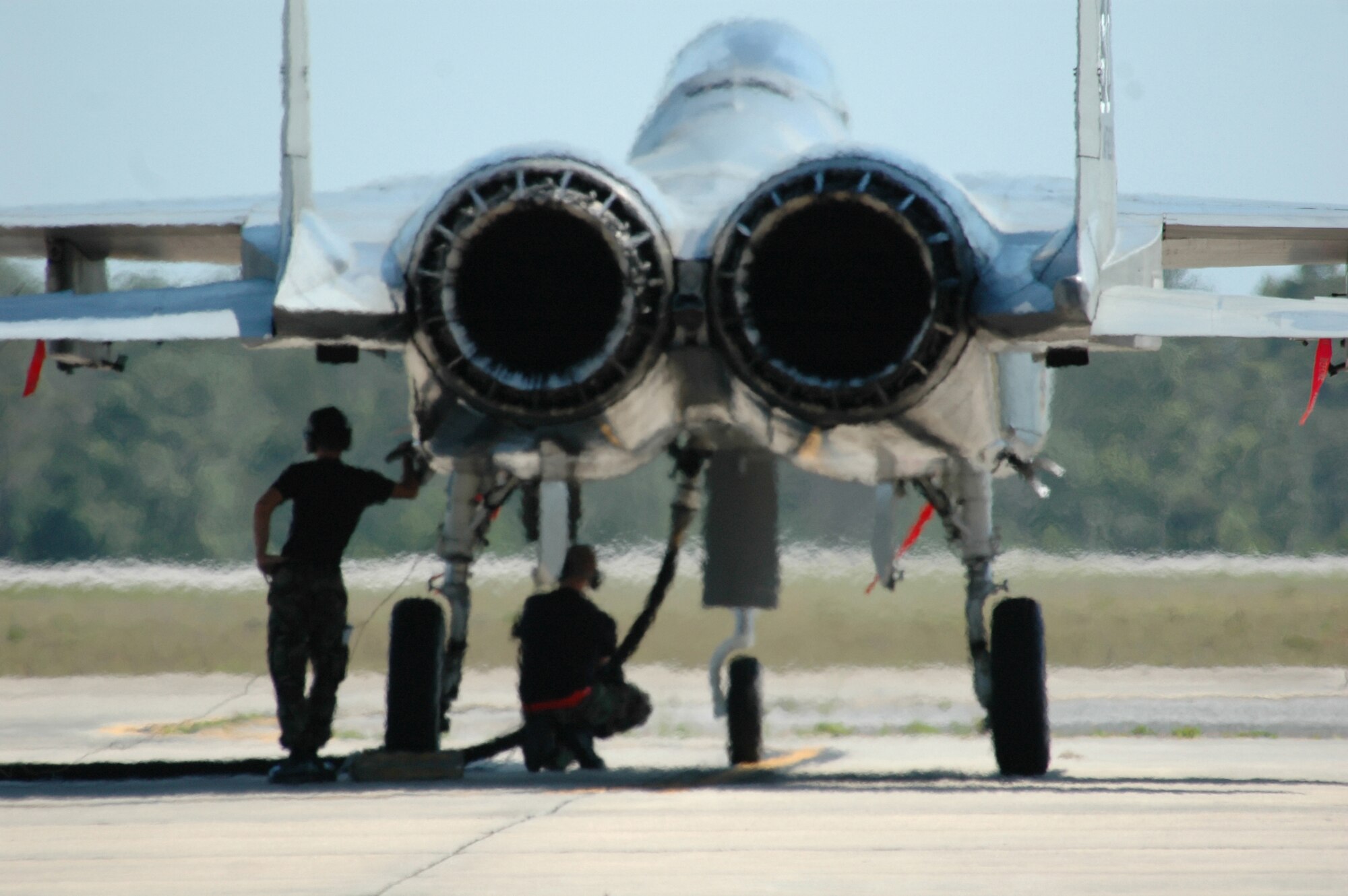 EGLIN AIR FORCE BASE, Fla. -- Two Airmen from the 33rd Aircraft Maintenance Squadron refuel an F-15C during surge operations May 8-10 here. Surge operations test maintainers' abilities to generate more sorties than normal and give pilots an increased number of flying hours in a condensed time period. The 33rd Fighter Wing averages more than 80 sorties a day during surge operations. (U.S. Air Force photo by Staff Sgt. Mike Meares)