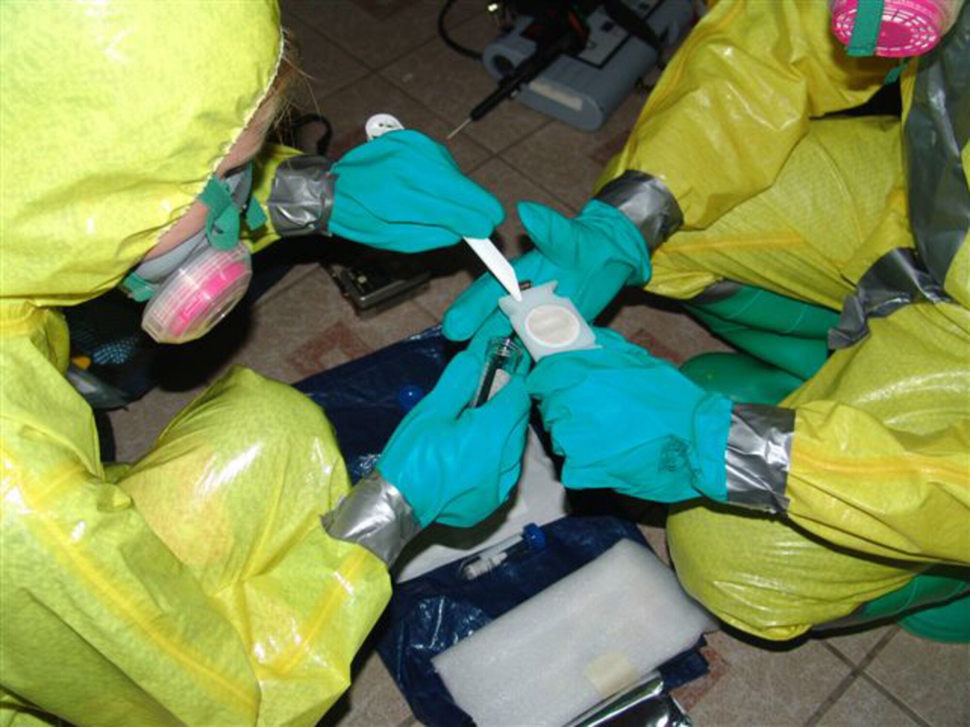 The combined Nellis and Mountain Home AFBs team won the 2007 Air Combat Command Chemical-Biological-Radiological-Nuclear (CBRN) Challenge that took place in Brooks AFB, Texas, April 2007. Tech. Sgt. Dawn Kolczynski and Senior Airman Stephanie Lewis, both with 99th Air Space Medical Squadron Bioenvironmental Engineering Flight, and Senior Airman Patrick Bellamy with 99th Civil Engineer Squadron's Emergency Management office participated in the event on behalf of the Nellis AFB. Six six-man teams, each representing two ACC bases, competed for the privilege to represent the ACC in a CBRN challenge at the Air Force level later this year. The five-day event consisted of five challenges - including a suspicious package scenario, a terrorist attack with a chemical explosion, a dirty bomb scenario, a chemical warfare response at a deployed location, and a biological threat incident. 
(Courtesy photo)