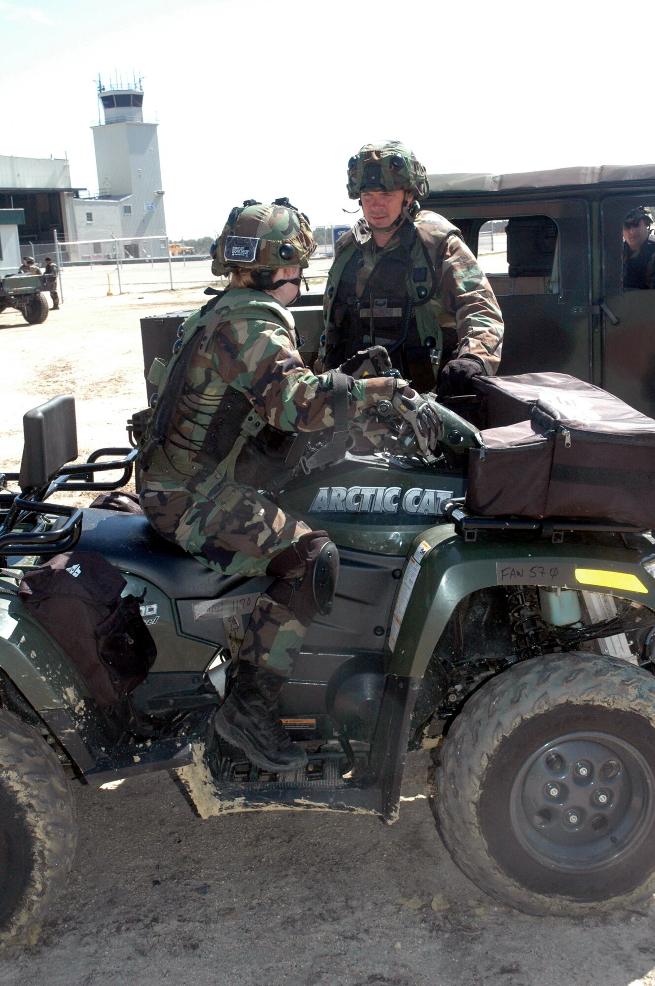 1st Lt. Keryn Ross and Col. Richard Walberg, 818th Contingency Response Group, discuss operations as part Air Force Exercise Eagle Flag, April 20, 2007, at Naval Air Engineering Station Lakehurst, N.J.  Both were part of an eight-person advance team for the 818th CRG participating in the exercise.  The exercise is coordinated by the U.S. Air Force Expeditionary Center's 421st Combat Training Squadron.  (U.S. Air Force Photo by Tech. Sgt. Scott T. Sturkol)