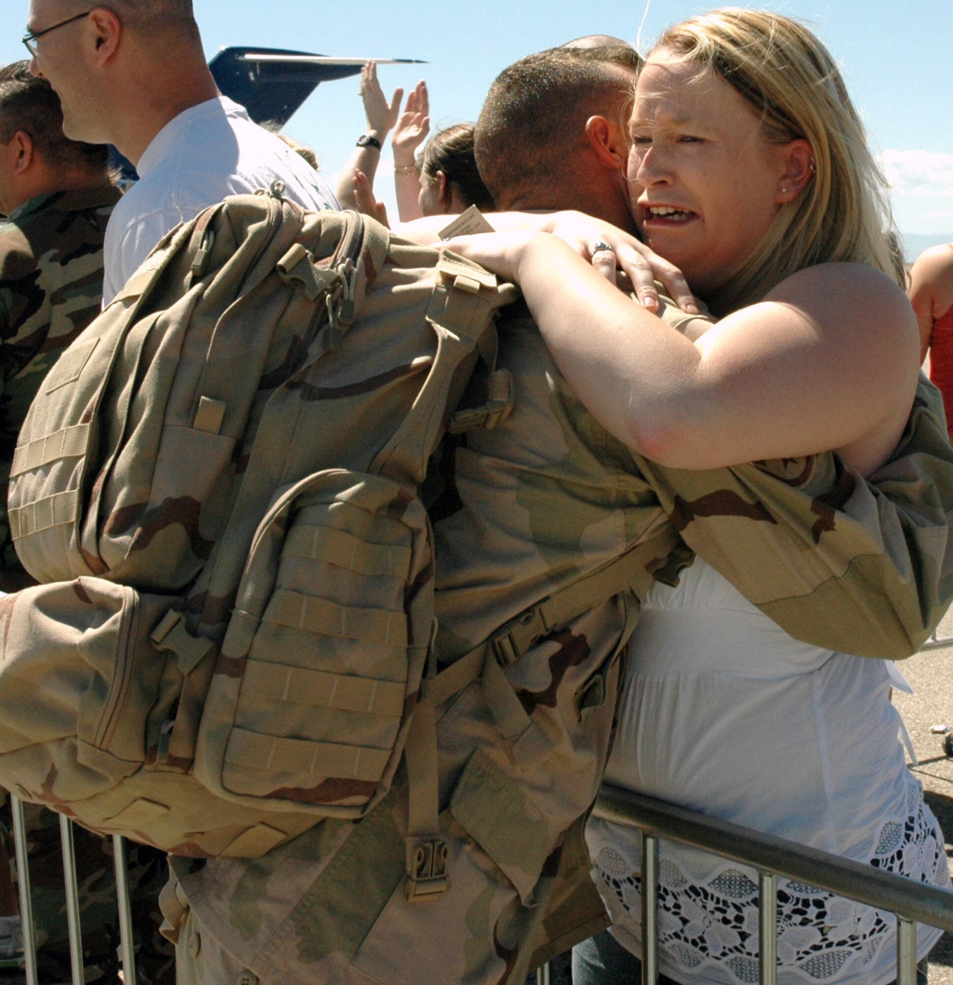 Amy Barber welcomes home returning deployed member Staff Sgt. Stan Fossette May 8 at Mountain Home Air Force Base, Idaho. The base greeted 35 members from the 366th Civil Engineer Squadron who helped to build new work centers and living quarters to accommodate additional forces serving at forward operating locations in Iraq and Afghanistan. (U.S. Air Force photo/Master Sgt. Brian S. Orban) 