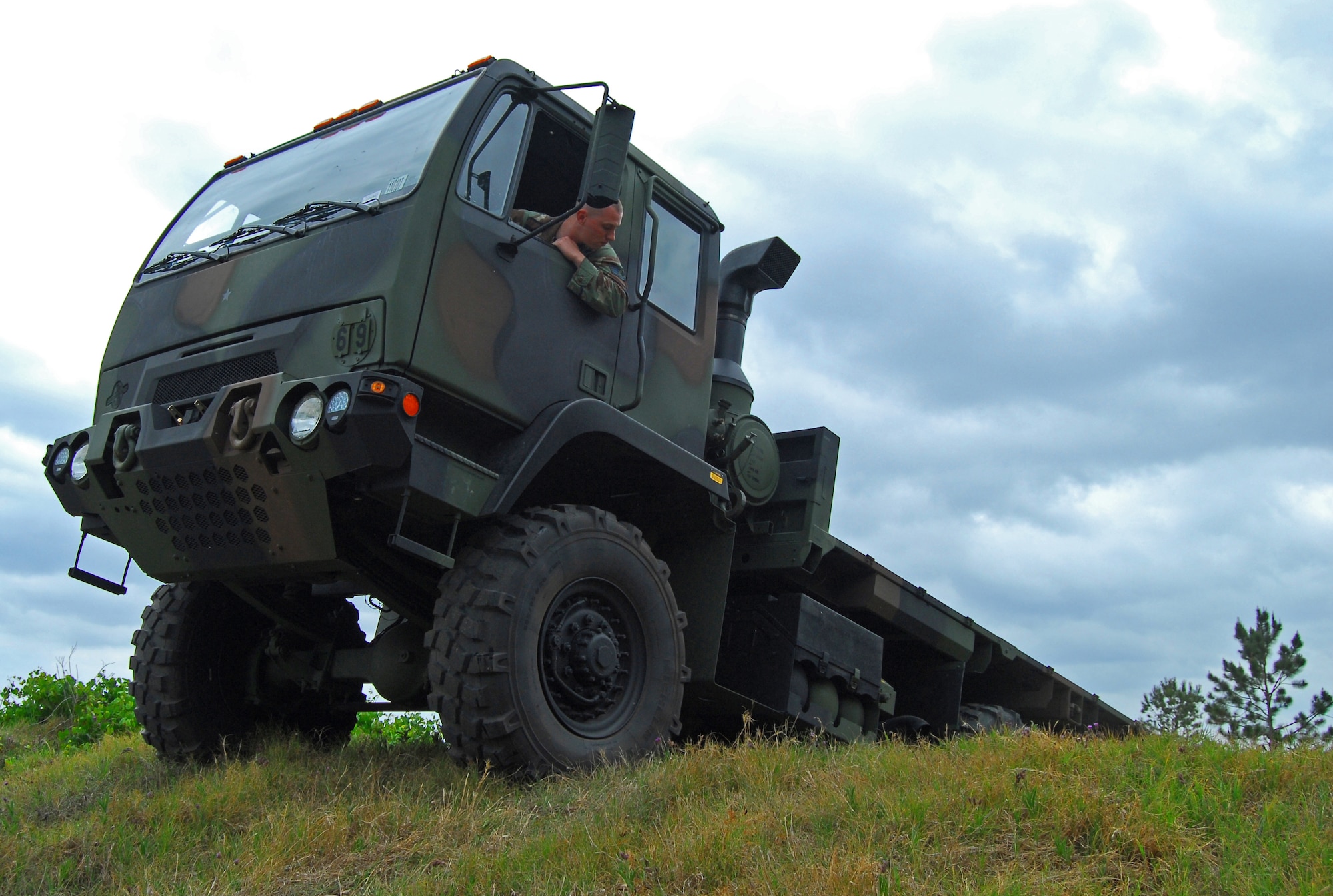 Staff Sgt. Tim Bele, 820th Security Forces Group vehicle mechanic, navigates one of Moody Air Force Base's new medium tactical vehicles over an obstacle here May 9.  The MTV is a replacement for the M923 five-ton utility truck.  (U.S. Air Force photo by Tech. Sgt. Parker Gyokeres)