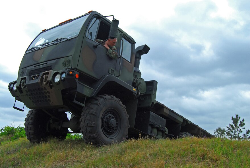 Staff Sgt. Tim Bele, 820th Security Forces Group vehicle mechanic, navigates one of Moody Air Force Base's new medium tactical vehicles over an obstacle here May 9.  The MTV is a replacement for the M923 five-ton utility truck.  (U.S. Air Force photo by Tech. Sgt. Parker Gyokeres)