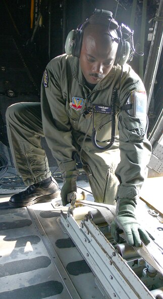 Master Sgt. Joe Blackman, 71st Rescue Squadron loadmaster, performs a pre-flight inspection on an HC-130 here May 10. The sergeant was recently selected to attend an Air Force Institute of Technology master's degree program at Wright-Patterson Air Force Base, Ohio. (Photo by Airman 1st Class Eric Schloeffel)