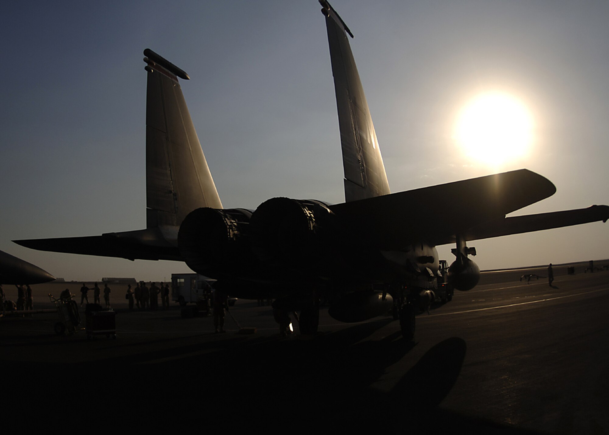 An F-15E Strike Eagle awaits its next mission in Southwest Asia. The F-15E's low-altitude navigation and targeting infrared for night, or LANTIRN, system allows the aircraft to fly at low altitudes, at night and in any weather conditions, to attack ground targets with a variety of precision-guided and unguided weapons. (U.S. Air Force photo) 
