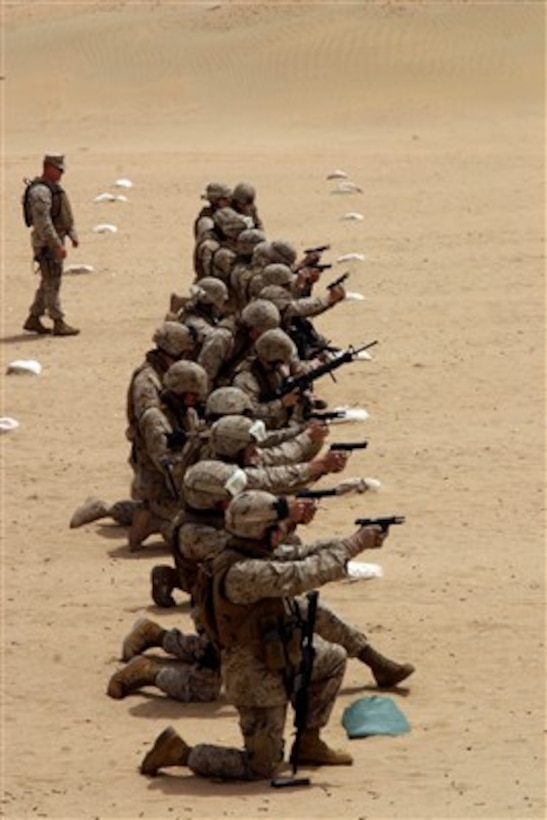 U.S. Marines and sailors of the 26th Marine Expeditionary Unit participate in a combat marksmanship program shoot at Udairi Range, Kuwait, on April 28, 2007.  The 26th Marine Expeditionary Unit is ashore in Kuwait conducting scheduled sustainment training.  