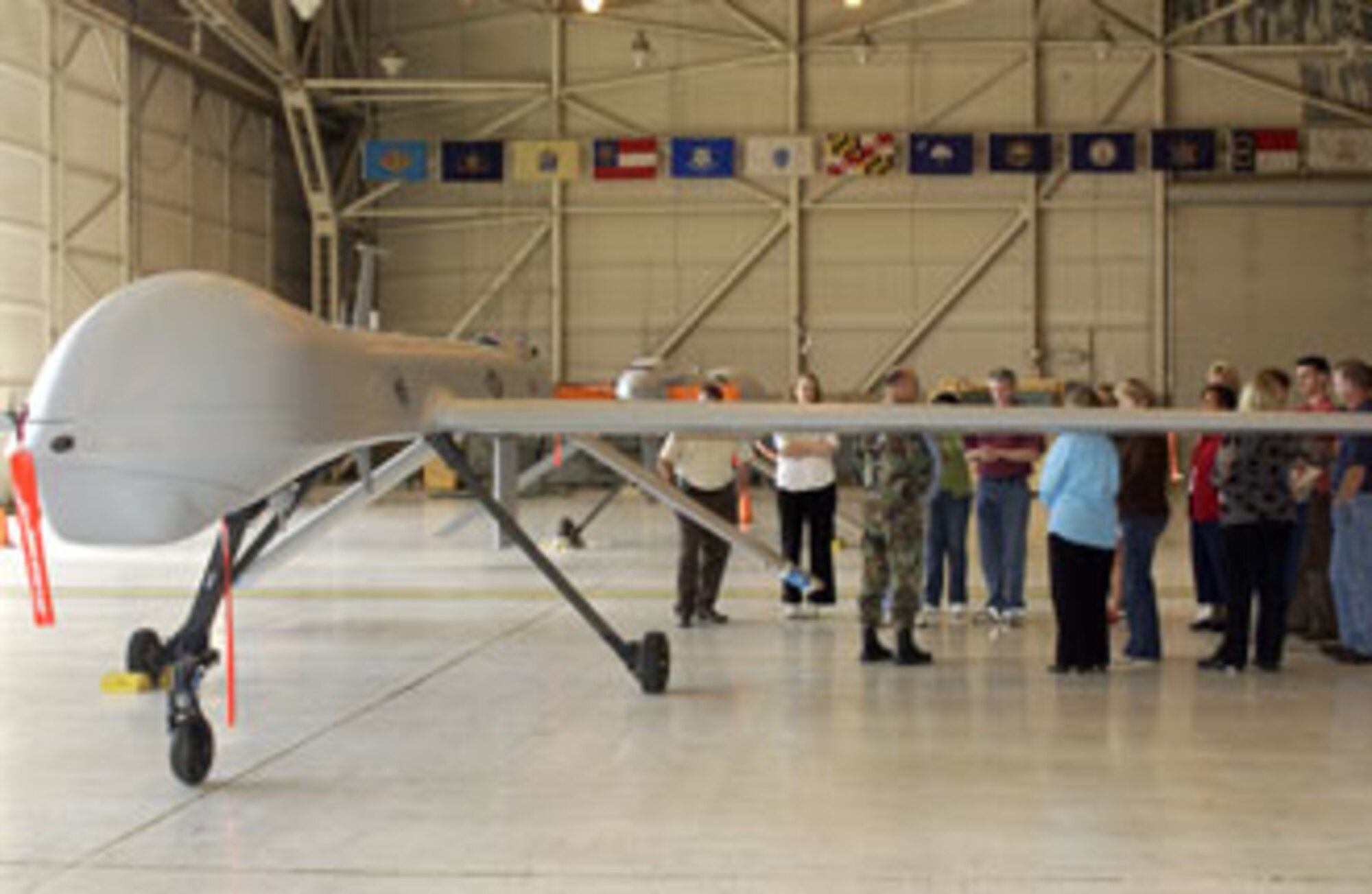 The Leadership Riverside views a Predator from the California Air National Guard's 163rd Reconnaissance Wing during their recent tour of March Air Reserve Base. (U.S. Air Force photo by Staff Sgt. Amy Abbott, 452AMW/PA)