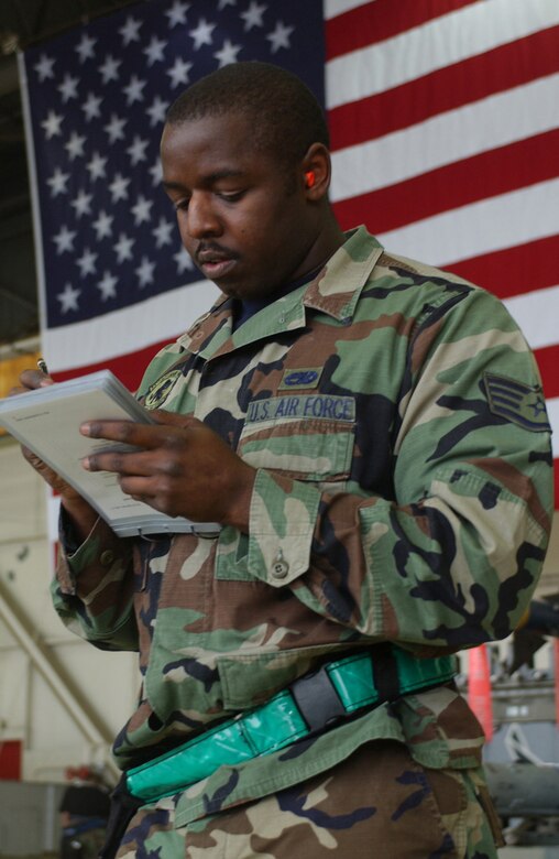 KUNSAN AIR BASE, Republic of Korea  May 12, 2007 -- Staff Sgt. Eric Harris, 8th Aircraft Maintenance Squadron, reviews a munitions loading checklist during the semi-annual 7th Air Force peninsula-wide weapons loading competition. This competition is held between Osan and Kunsan twice a year, once at each base. (U.S. Air Force photo/Senior Airman Darnell Cannady)   