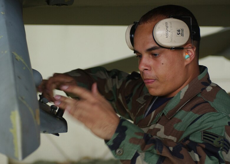 KUNSAN AIR BASE, Republic of Korea  May 12, 2007 -- Senior Airman Daniel Diaz preforms a station prep to a wing weapons pylon on an 8th Fighter Wing "Wolf Pack" F-16 Fighting Falcon during the semi-annual 7th Air Force peninsula-wide weapons loading competition. This competition is held between Osan and Kunsan twice a year, once at each base. (U.S. Air Force photo/Senior Airman Darnell Cannady)                        