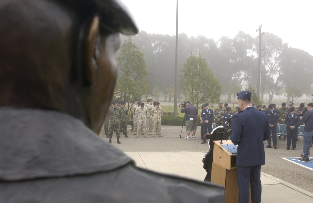Capt. Mark Robertson,30th Space Wing head chaplain, delivers the invocation to honor Cpl. David Williams, and Airman 1st Class Leebernard Chavis at a memorial ceremony held by the 30th Security Forces Squadron at Vandenberg on May 14.  The security forces memorial reflects names of fallen Airmen in the security forces career field who were killed in the line of duty.  (U.S. Air Force photo by Airman 1st Class Adam Guy)