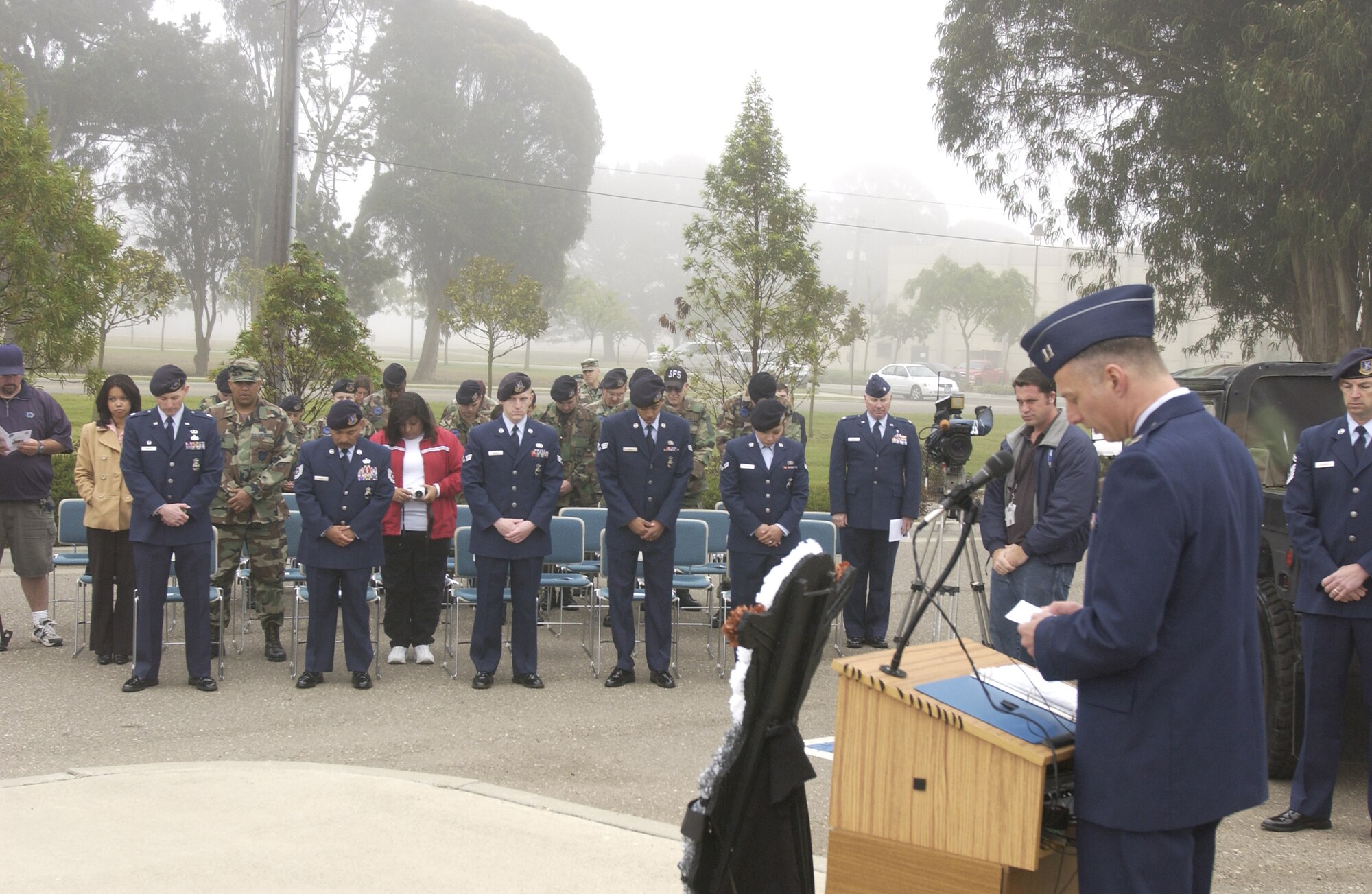 Capt. Mark Robertson, 30th Space Wing head chaplain, delivers the invocation to honor Cpl. David Williams, and Airman 1st Class Leebernard Chavis at a memorial ceremony held by the 30th Security Forces Squadron on May 14.  The Security Forces Memorial reflects names of fallen Airmen in the Security Forces career field who were killed in the line of duty.  (U.S Air Force photo by Airman 1st Class Adam Guy)