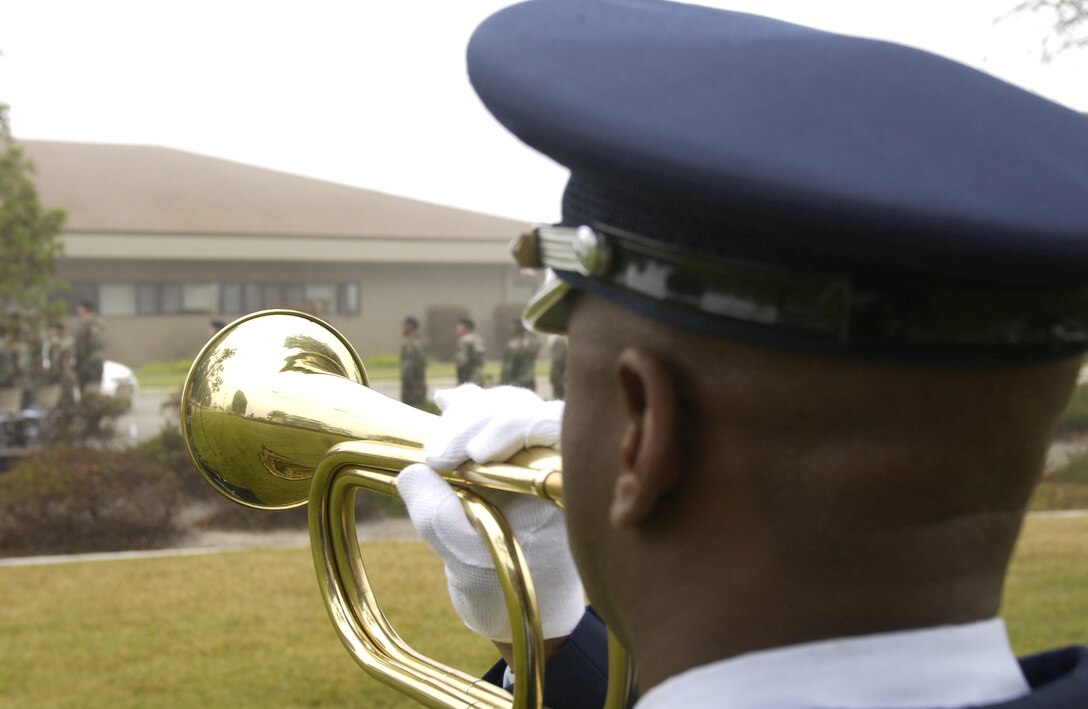 Taps is played at a security forces memorial ceremony to honor Cpl. David Williams, and Airman 1st Class Leebernard Chavis at Vandenberg on May 14.  The security forces memorial reflects names of fallen Airmen in the security forces career field who were killed in the line of duty.  Cpl. Williams of Tamaqua Pennsylvania died March 4, 1951 in the line of duty while performing base security at Offut Air Force Base, NE.  Airman 1st Class Chavis of Hampton, Virginia died October 14, 2006, while performing duties as a turret gunner with the 732nd Expeditionary Security Forces Squadron Det. 7 in Iraq. (U.S. Air Force photo by Airman 1st Class Adam Guy)(Released)