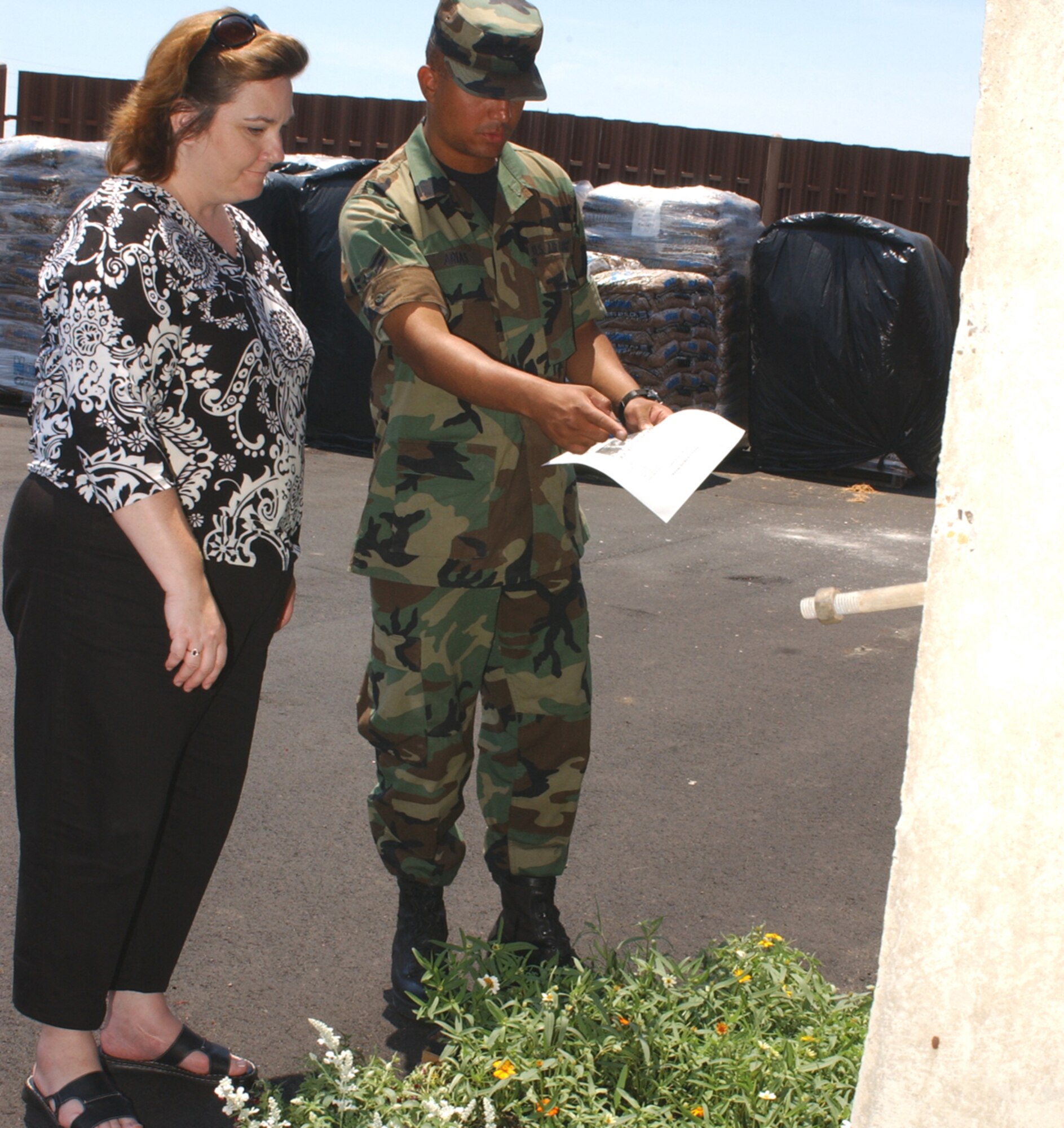 Margo Valenzuela is assisted in making plant selections at the self-help store by Airman 1st Class Jose Arias, 332nd Training Squadron.  She’s the spouse of Lt. Col. Paul Valenzuela, 81st Mission Support Squadron commander.  (U.S. Air Force photo by Kemberly Groue)