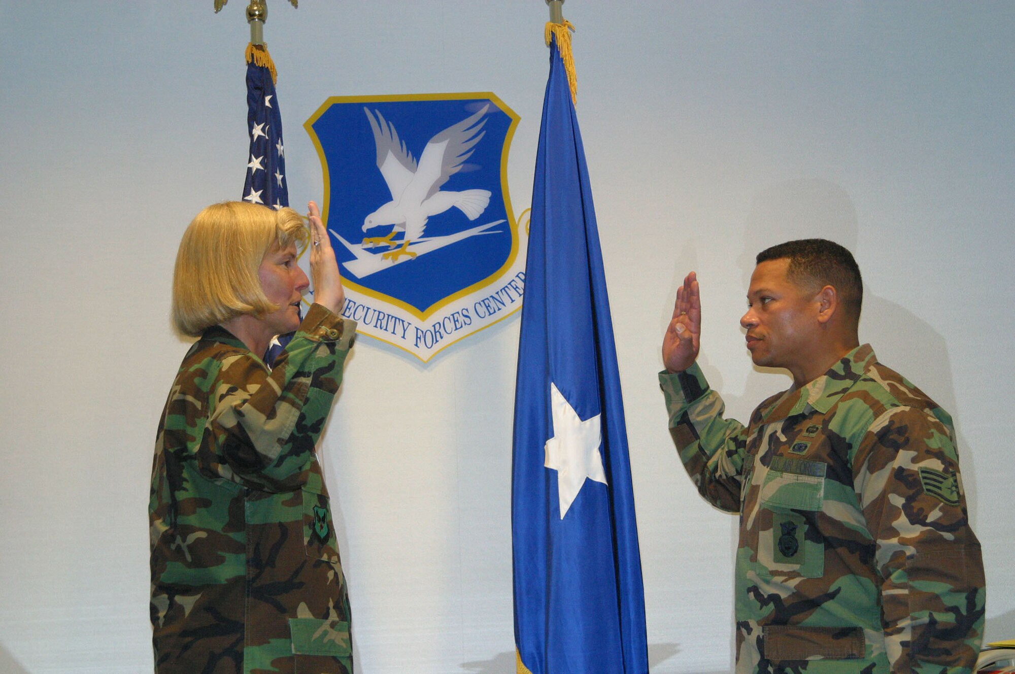 Brig. General Mary Kay Hertog, Director of Security Forces, Headquarters U.S. Air Force, Washington, D.C., administers the oath of office to Staff Sgt. Oliver George as he is promoted to the rank of Captain. Captain George, formerly the career advisor for the 433rd Security Forces Squadron is now the Officer-in-charge of the 433rd Explosive Ordnance Disposal Flight. Additionally, Captain George is serving on active-duty as an Action Officer in the Requirements Branch at the Headquarters Security Forces Center. (U.S. Air Force/Courtesy Photo)