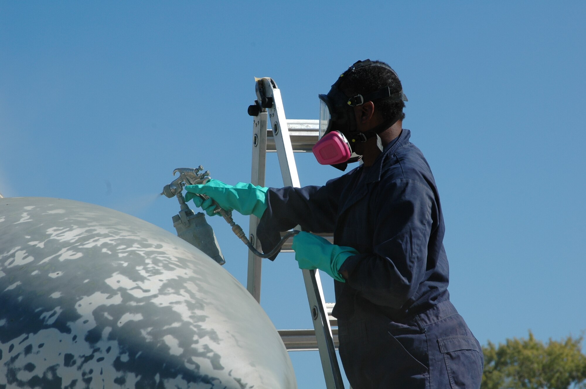 Cartria Carthern, a technical sergeant in the 917th Maintenance Squadron, paints the F-4 Sept. 27, 2006. (U.S. Air Force photo/Tech. Sgt. Sherri Bohannon)