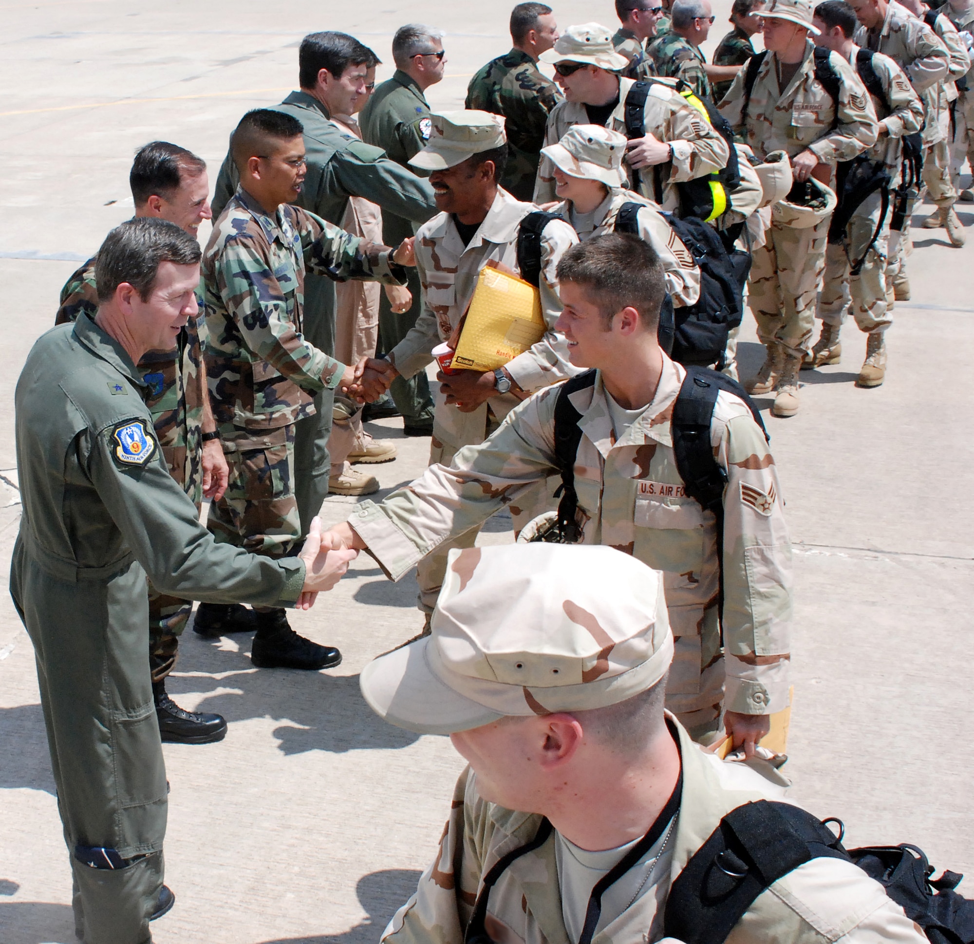 301st Fighter Wing members met with wing and 10th Air Force commanders before boarding a contract aircraft to Southwest Asia. Nearly 300 Air Force Reserve troops deployed recently to support the current Aerospace Expeditionary Force cycles. (U.S. Air Force Photo/Maj. Karl Lewis)