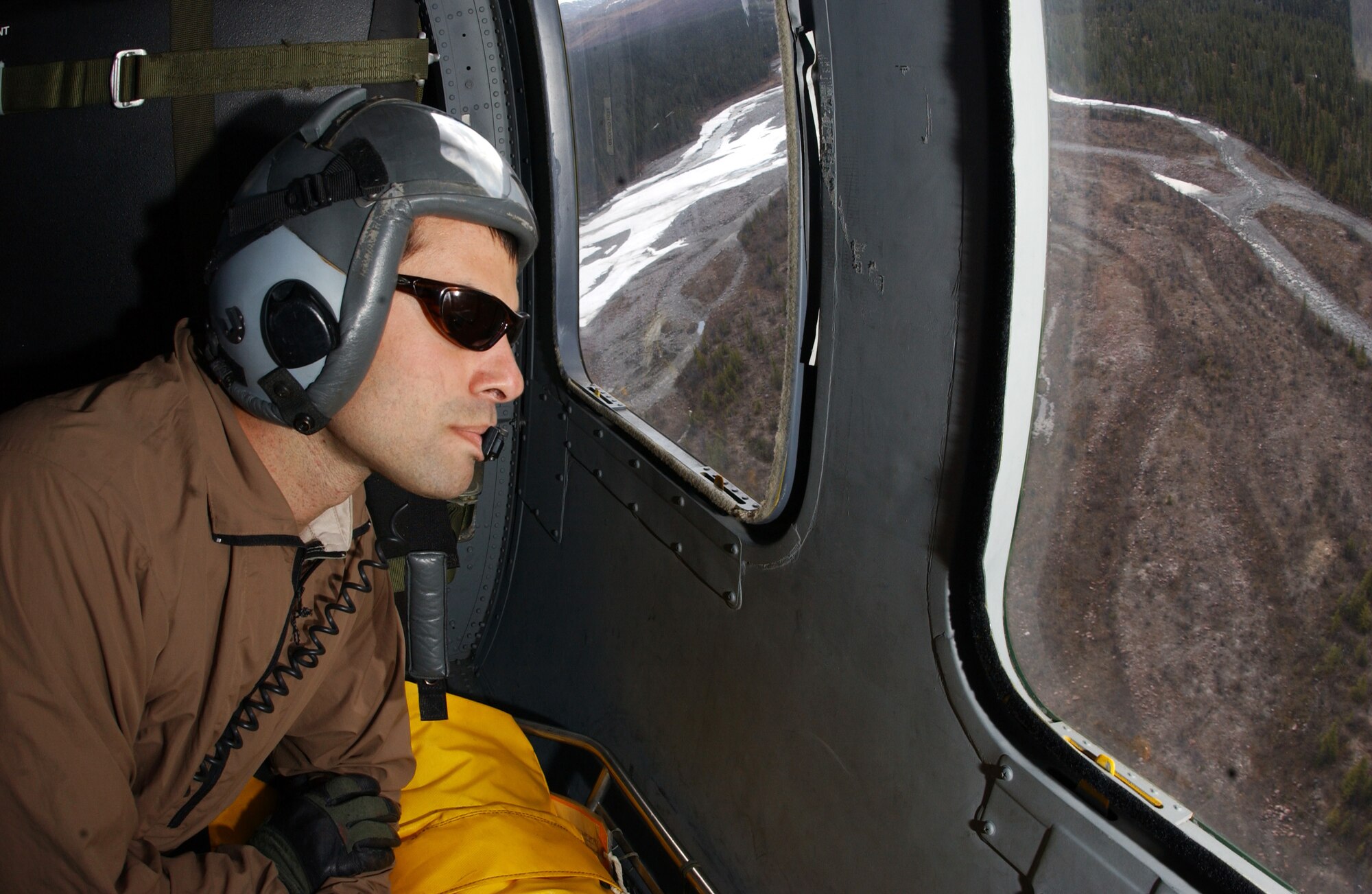 Master Sgt. Jon Davis scans the terrain for suspicious activity over the Trans-Alaska Pipeline System May 10 during Northern Edge. The exercise is designed to practice operations, techniques and procedures, and enhance interoperability among all the services and civilian emergency response teams. Sergeant Davis is a pararescueman assigned to Det. 1, 210th Rescue Squadron, at Eielson Air Force Base, Alaska. (U.S. Air Force photo/Airman 1st Class Jonathan Snyder)
