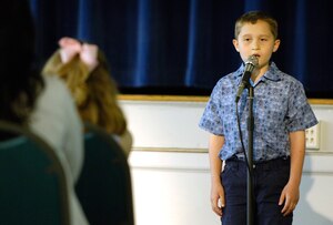 Michael Harding, age 9, sings “Amazing Grace” during the seventh annual Grand Recital at the Langley Community Center May 11.  Michael is the son of Master Sgt. David Harding, 83rd Communications Squadron operations controller.  The recital consisted of singers and musicians who take lessons at the community center. For information on voice and instrument lessons, call the community center at (757) 764-2983. (U.S. Air Force photo/Senior Airman Austin Knox)