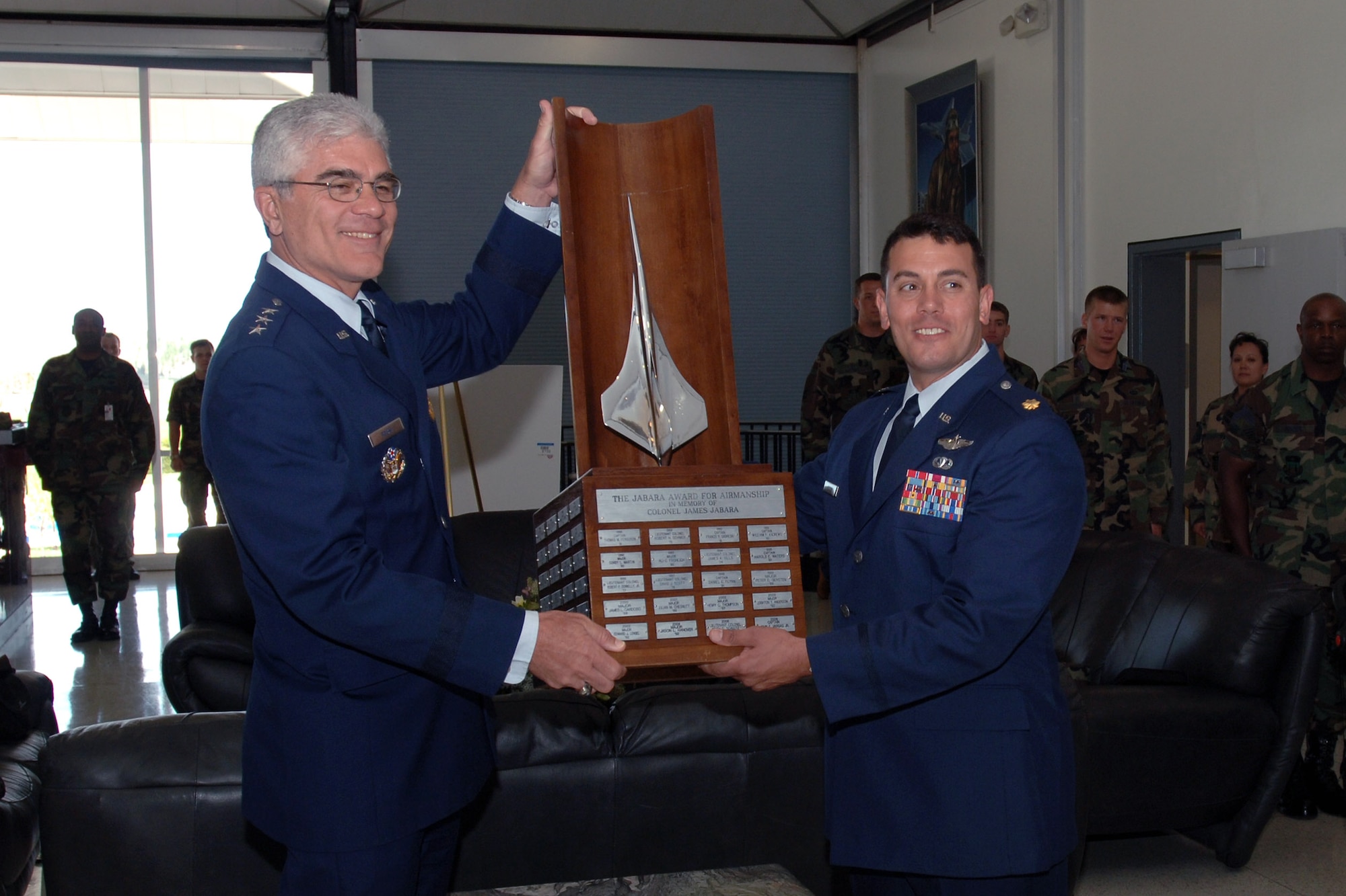Maj. Mark W. Visconi, right, receives the 2007 Col. James Jabara Award for Airmanship May 11 from Lt. Gen. John F. Regni, U.S. Air Force Academy superintendent, at the academy's Mitchell Hall dining facility. The Jabara Award for Airmanship is awarded each year to the U.S. Air Force Academy graduate whose accomplishments demonstrate superior performance in fields directly involved with aerospace vehicles. (U.S. Air Force photo/David Armer) 
