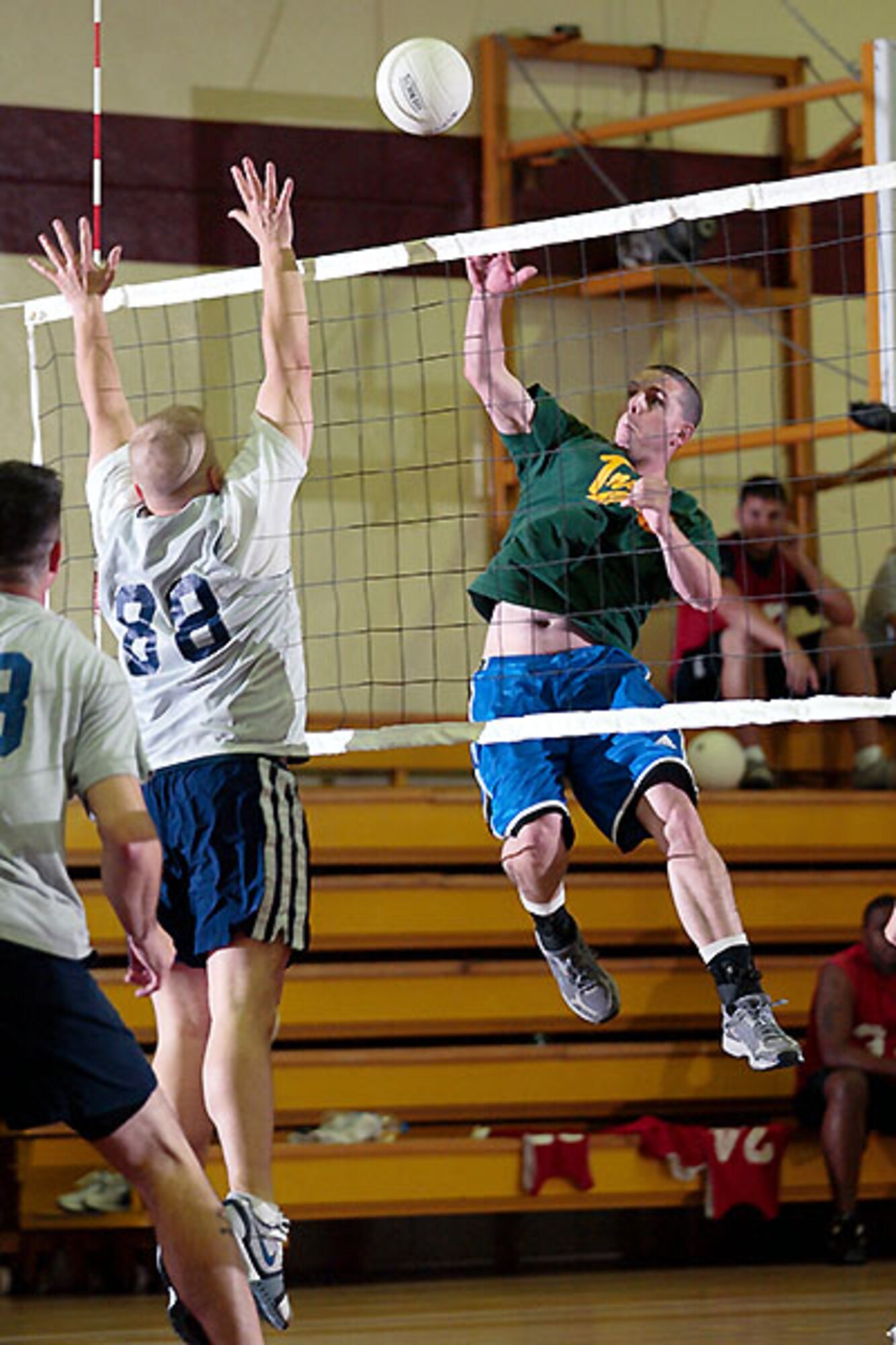Nick Armstead 39th Operations Squadron hits a spike against Robert Merwin 39th Mission Support Squadron during Incirlik's Intramural volleyball championship game May 14. (photo by Ismael Gomez)