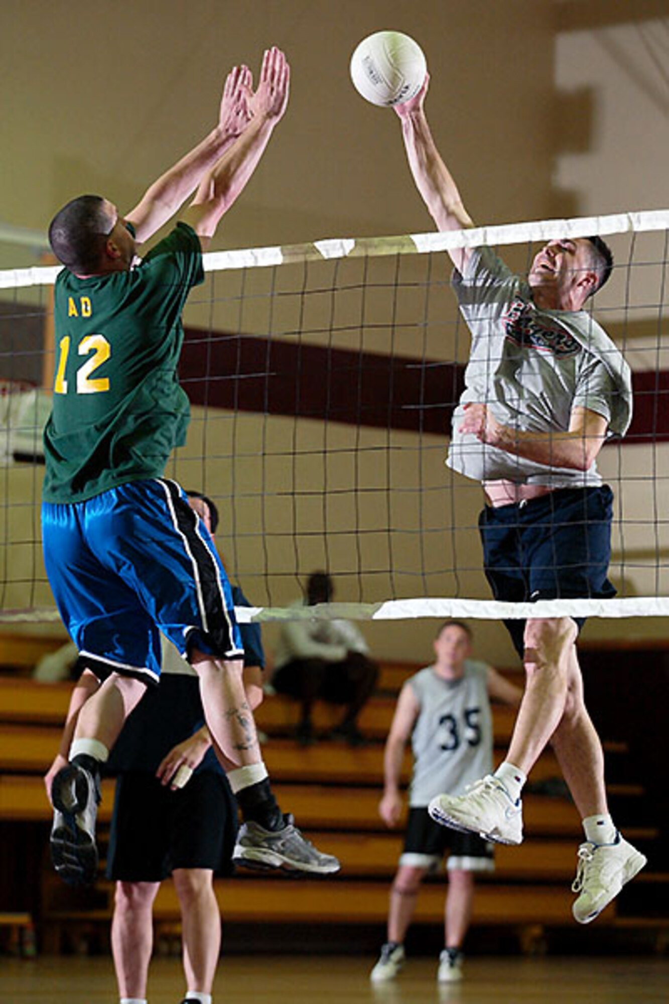 Andrew Jones 39th Mission Support Squadron tries to spike past Nick Armstead 39th Operations Squadron during Incirlik's Intramural volleyball championship game, on May 14. (photo by Ismael Gomez)
