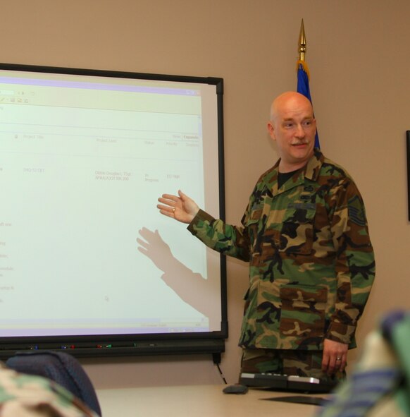 Master Sgt. Lou Pell, NCO in charge of the Air Force Weather Agency's training branch, leads a discussion of future training goals.  Sergeant Pell is the Air Force nominee for the 2007 U.S. Armed Forces Spirit of Hope Award.  Photo by Tech. Sgt. Jeremy Henderson.