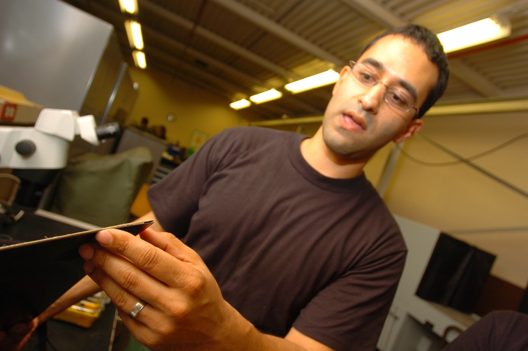 Tech Sgt. Antonio Mercado, a reservist from McChord AFB, Wa. shows an example of damage the sonogram can detect that can’t be seen by looking at the aircraft. Photo by Angela Elbern