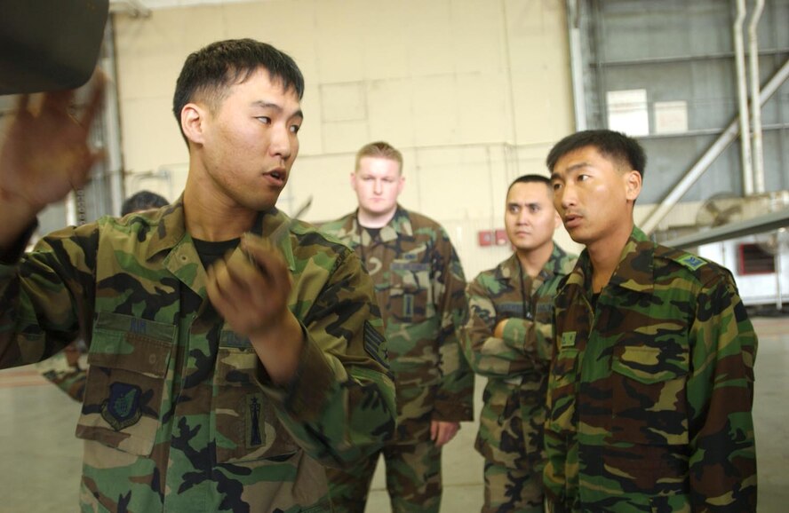 KUNSAN AIR BASE, Republic of Korea  May 16, 2007 -- Staff Sgt. John Kim, 8th Maintenance Group, goes over procedures to Republic of Korea air force members on using a weapons loading rail May 16. Members of the ROKAF 19th Air Base toured the 35th Fighter Squadron and Aircraft Maintenance Unit to gain a better understanding of F-16 maintenance and operations. (U.S. Air Force photo/Senior Airman Darnell Cannady)                                                                                            