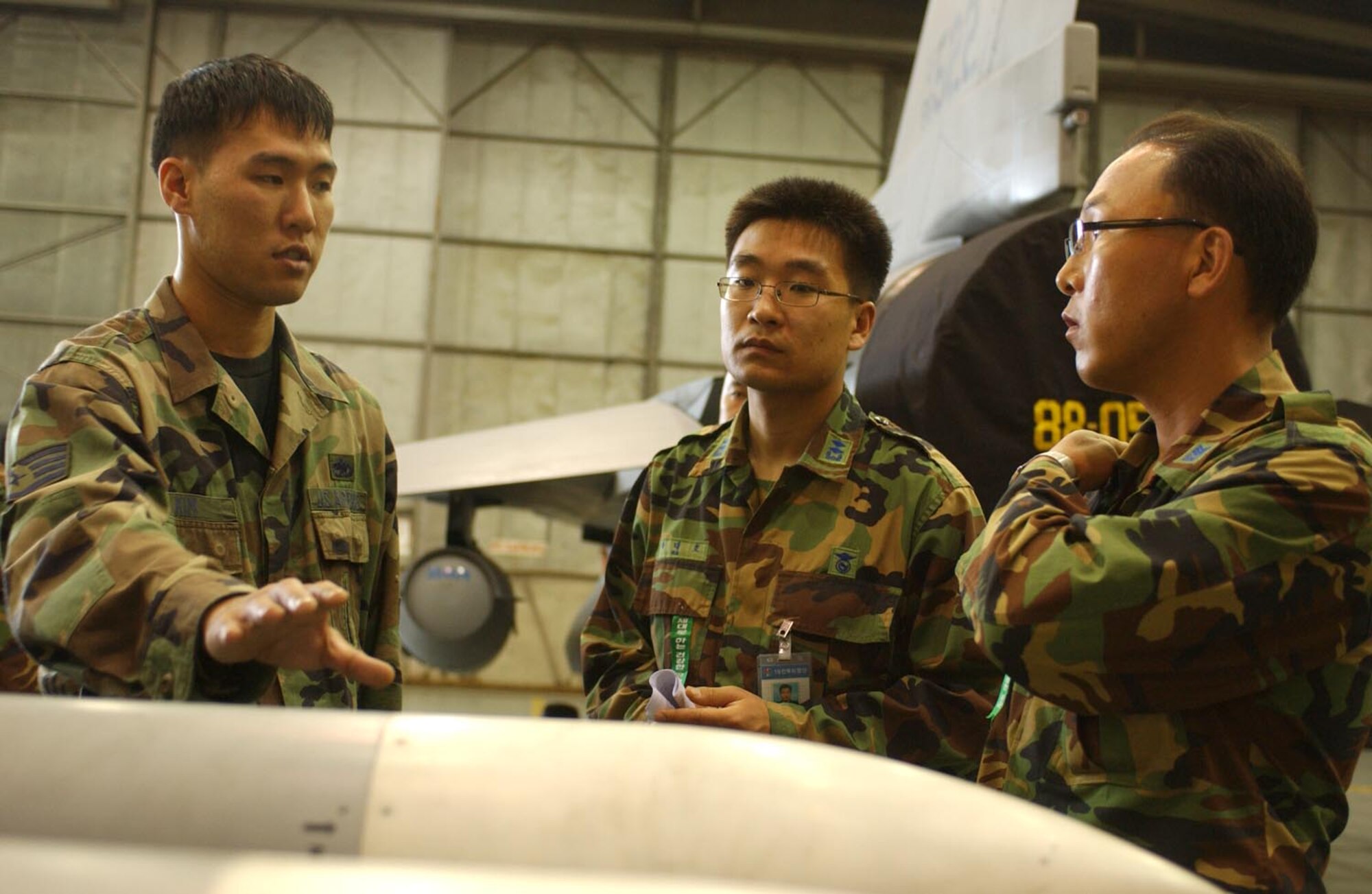 KUNSAN AIR BASE, Republic of Korea  May 16, 2007 -- Staff Sgt. John Kim, 8th Maintenance Group, explains to Republic of Korea air force members the challenges 8th Fighter Wing weapons maintainers face during advanced medium range air-to-air, or AMRAAM 120 (seen below) operations May 16. Members of the ROKAF 19th Air Base toured the 35th Fighter Squadron and Aircraft Maintenance Unit to gain a better understanding of F-16 maintenance and operations. (U.S. Air Force photo/Senior Airman Darnell Cannady)                              
