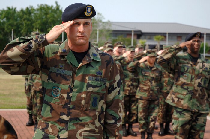 Lt. Col. Seth McKee, 437th Security Forces Squadron commander, renders a salute during a formal retreat ceremony here May 11 as part of National Police Week. (U.S. Air Force photo/Staff Sgt. Marie Cassetty)